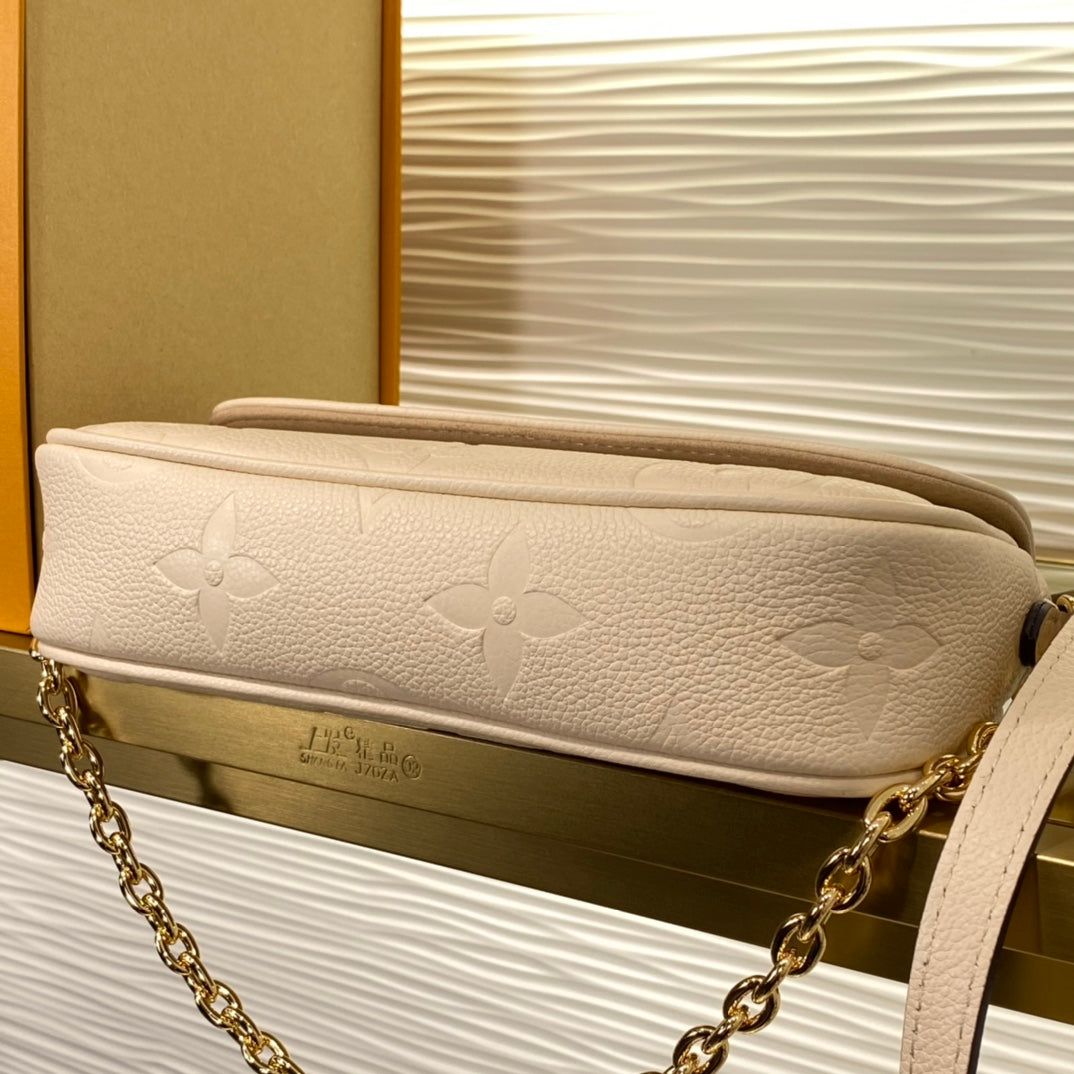 Louis Vuitton Lexington Pouch Monogram Empreinte Leather - Cream
