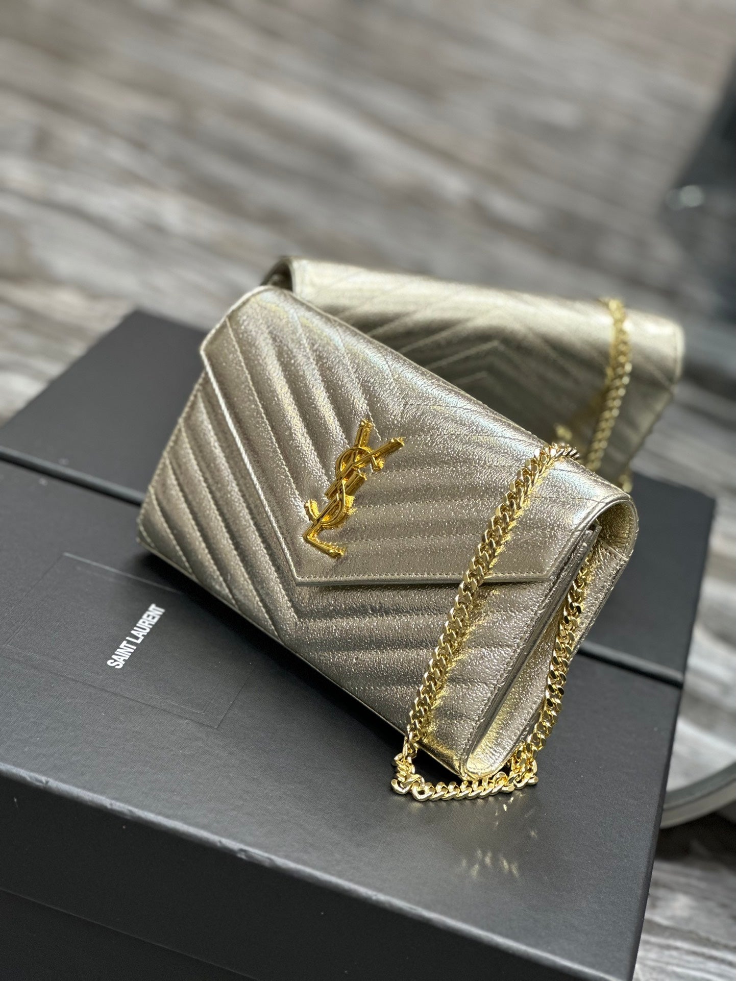 Saint Laurent Cassandre Matelassé Chain Wallet in Gold Leather