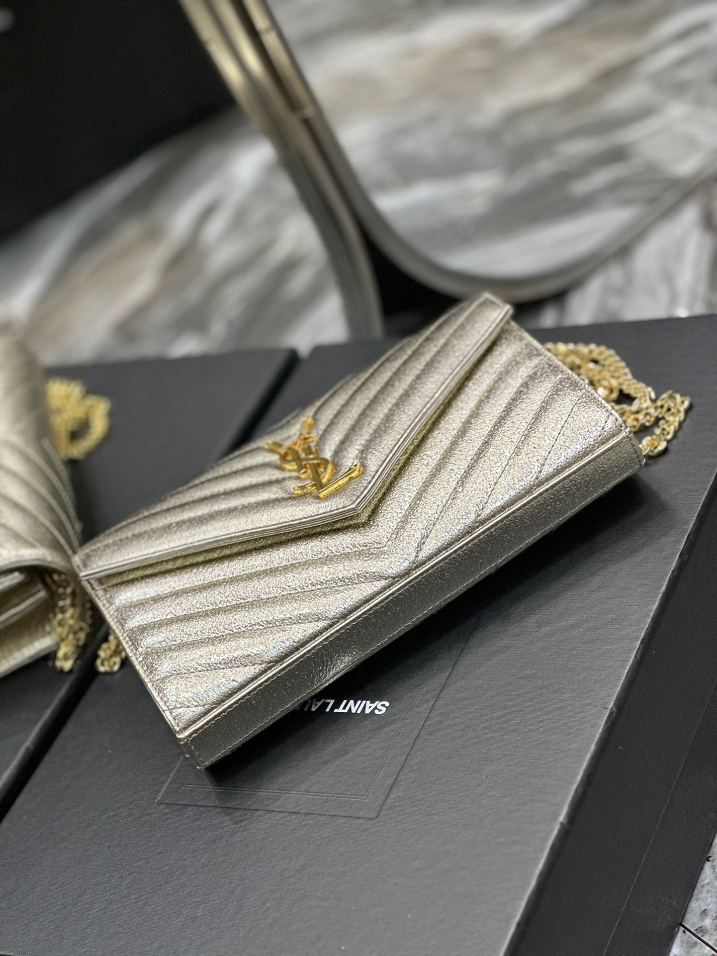 Saint Laurent Cassandre Matelassé Chain Wallet in Gold Leather