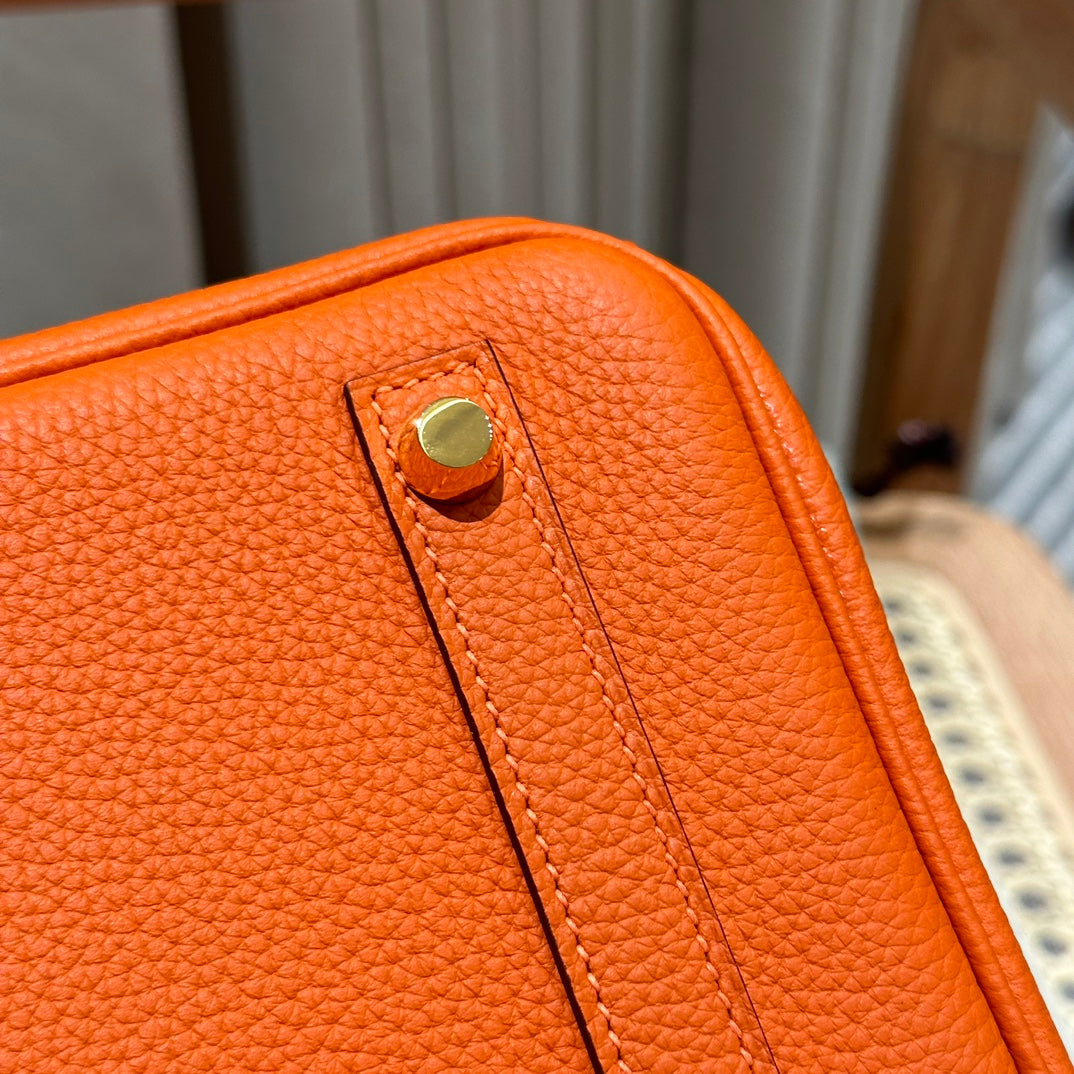 Classic Orange Leather Top-Handle Handbag with Gold-Tone Hardware
