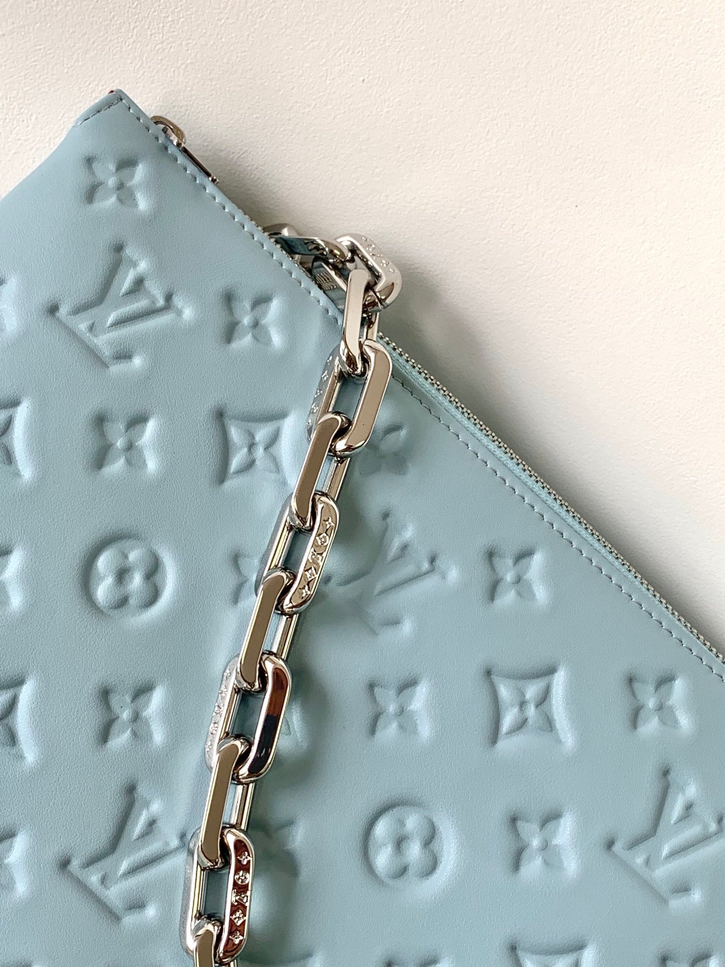 Light Blue Embossed Monogram Leather Crossbody Bag with Silver Chain Strap
