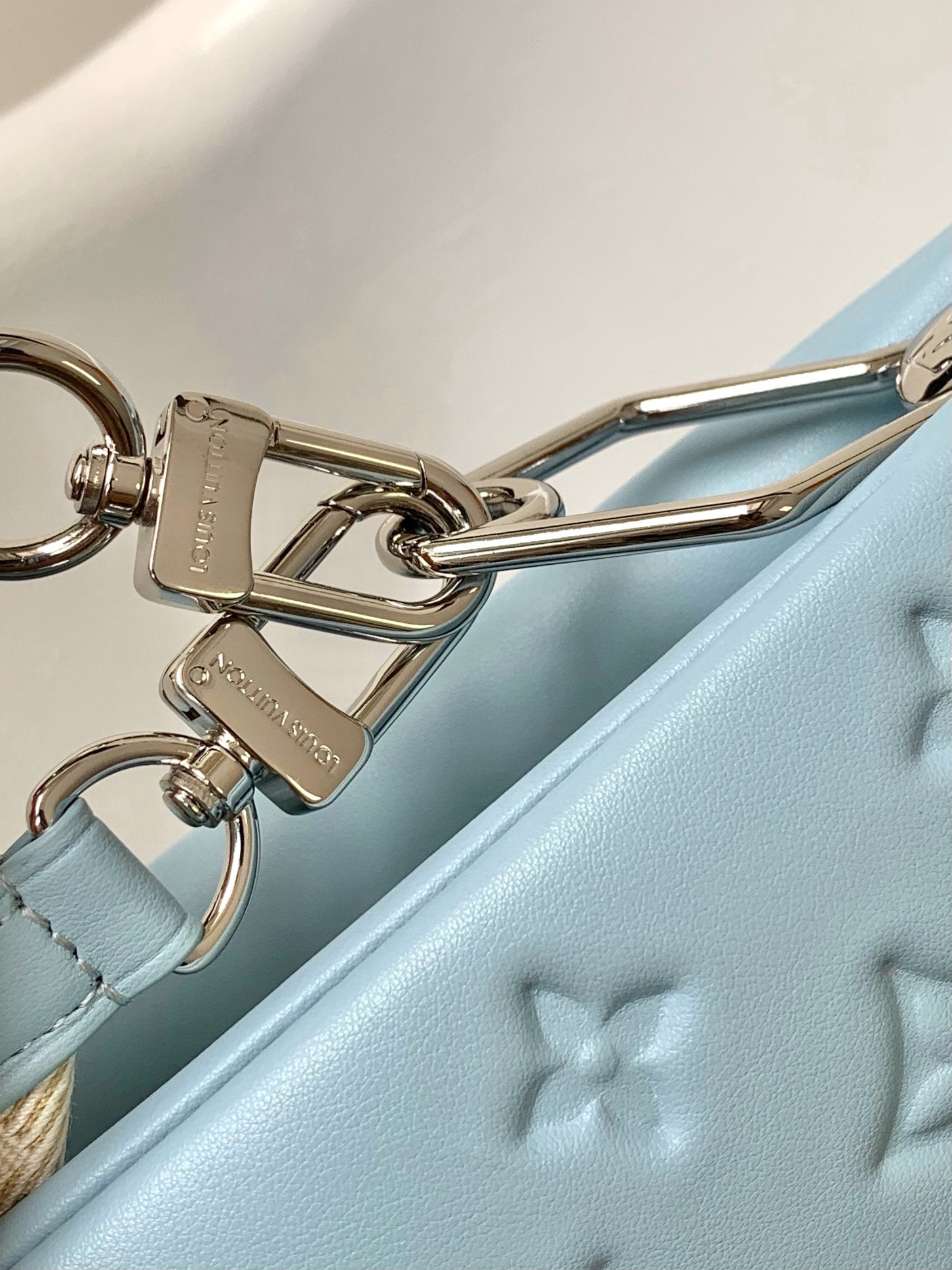 Light Blue Embossed Monogram Leather Crossbody Bag with Silver Chain Strap
