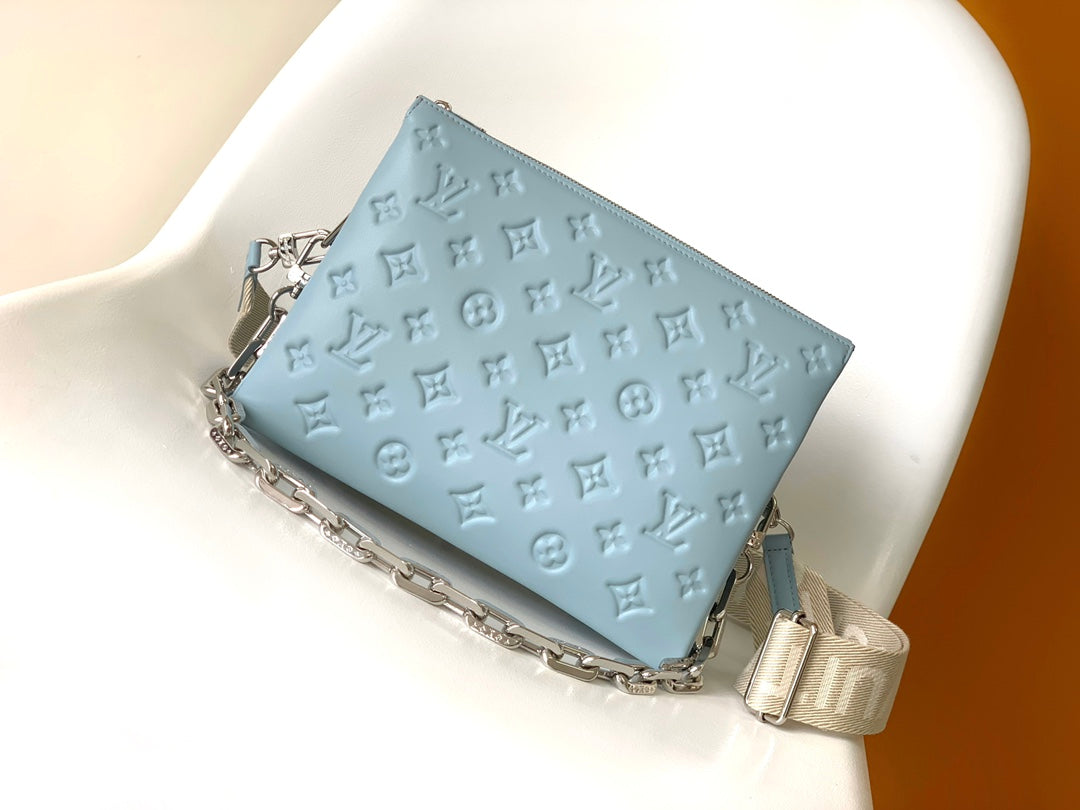 Light Blue Embossed Monogram Leather Crossbody Bag with Silver Chain Strap
