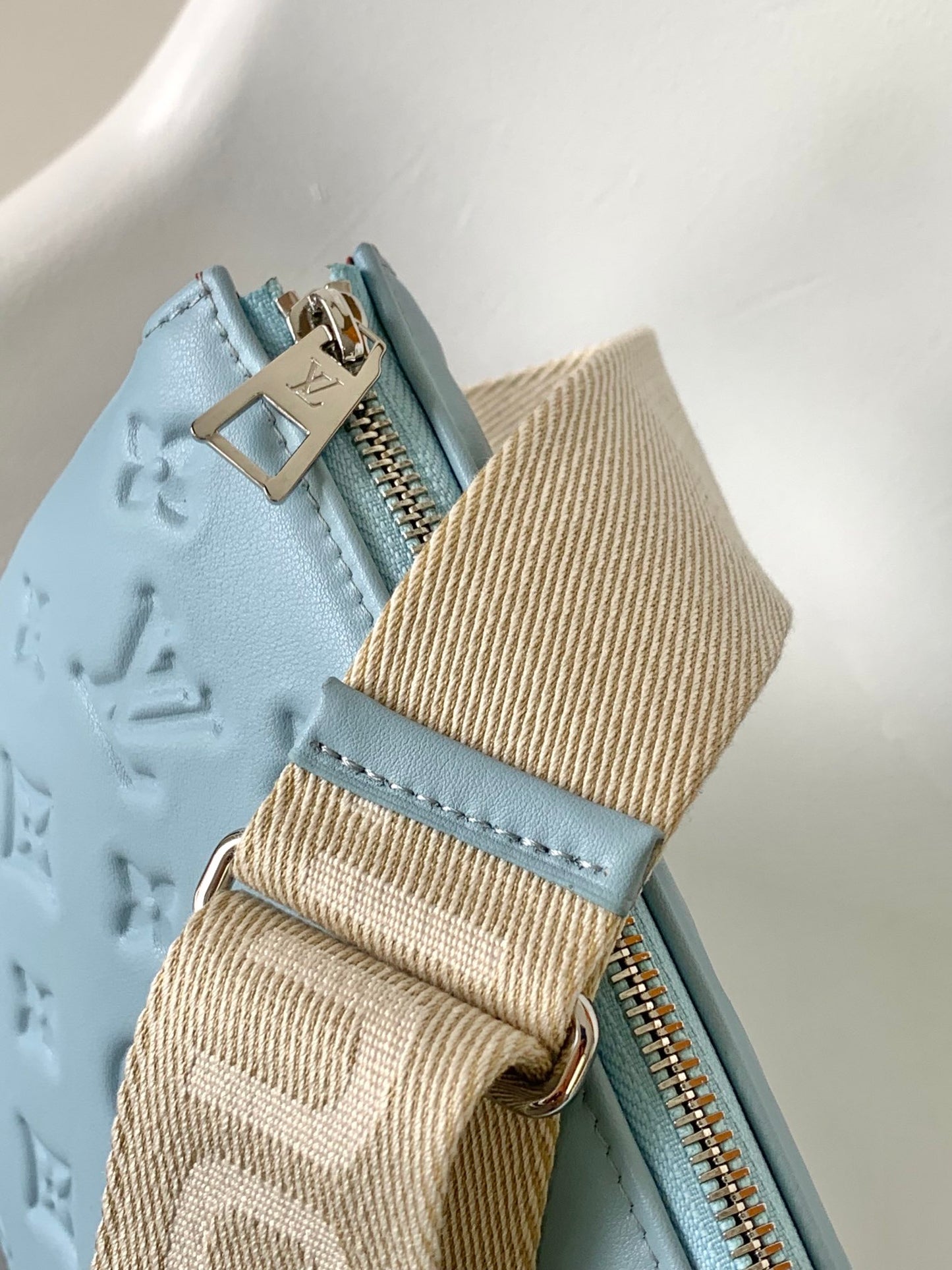 Light Blue Embossed Monogram Leather Crossbody Bag with Silver Chain Strap
