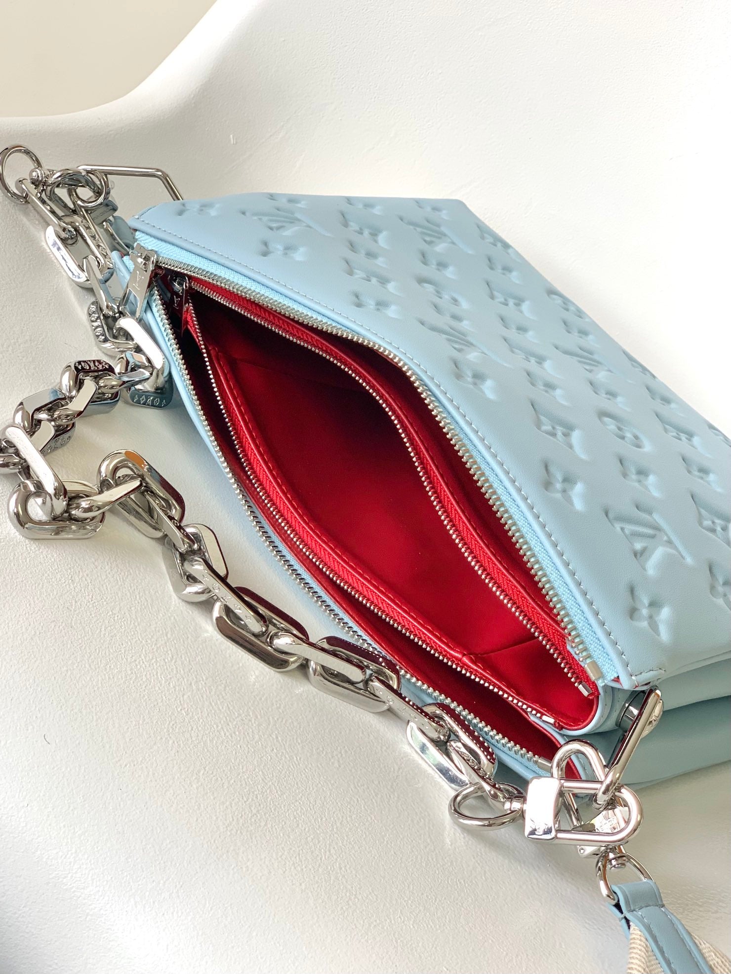 Light Blue Embossed Monogram Leather Crossbody Bag with Silver Chain Strap