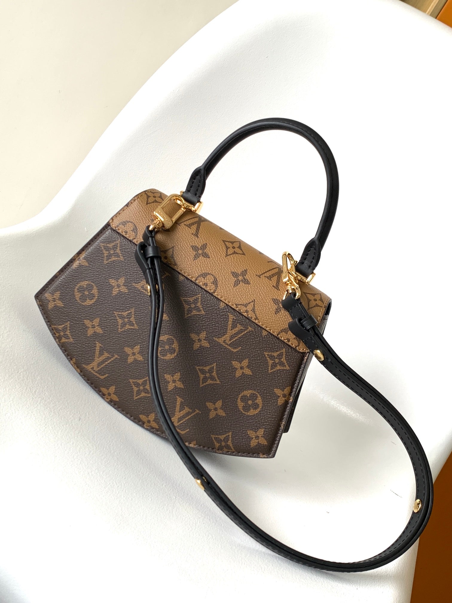 Louis Vuitton Tilcit Handbag Monogram and Monogram Reverse Canvas