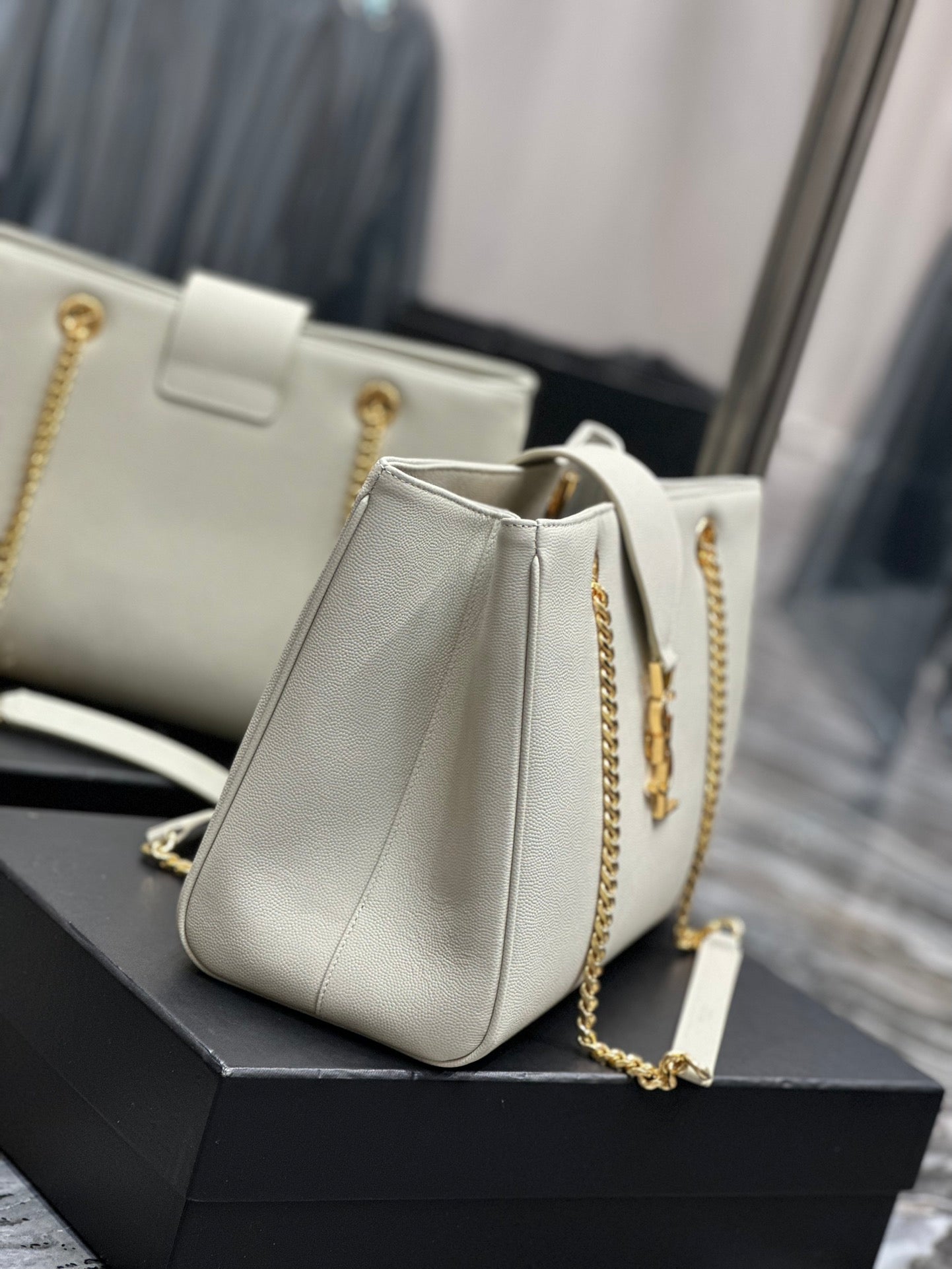 Luxury Off-White Leather Shoulder Bag with Gold Chain and Tassel