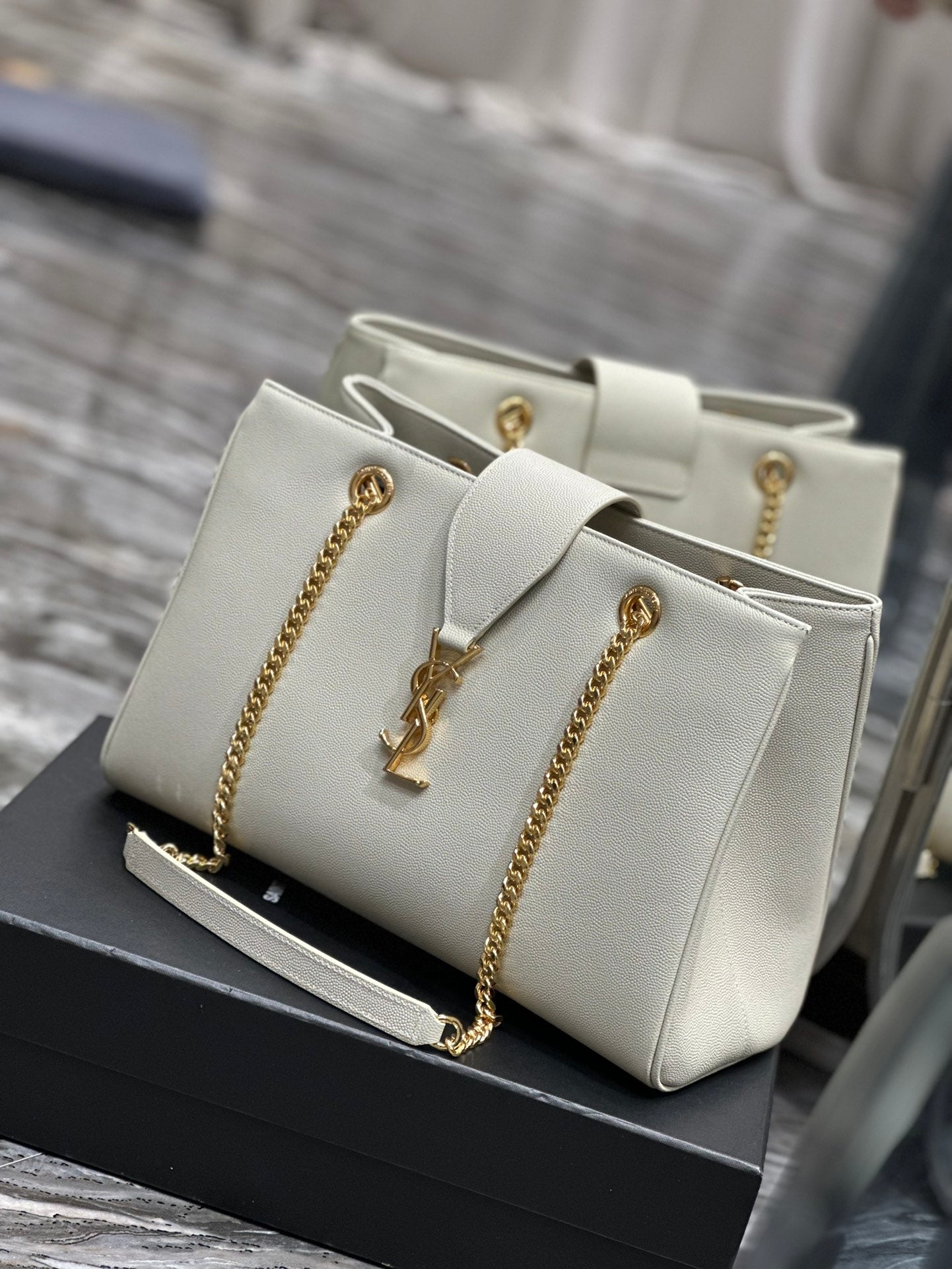 Luxury Off-White Leather Shoulder Bag with Gold Chain and Tassel