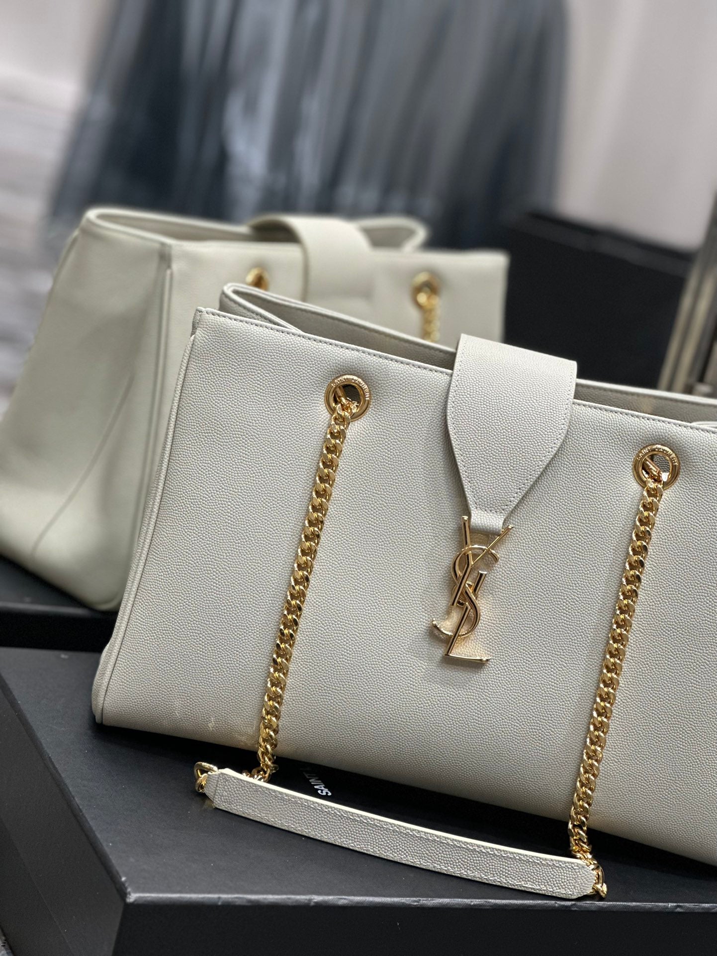 Luxury Off-White Leather Shoulder Bag with Gold Chain and Tassel