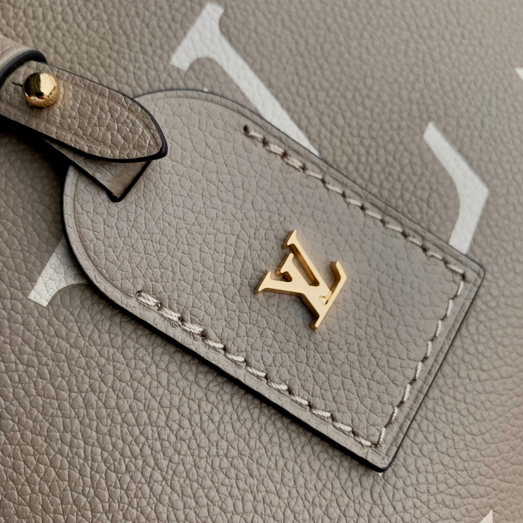 Louis Vuitton Madeleine MM Monogram Empreinte Giant Bicolor Leather Handbag - Turtledove/Cream