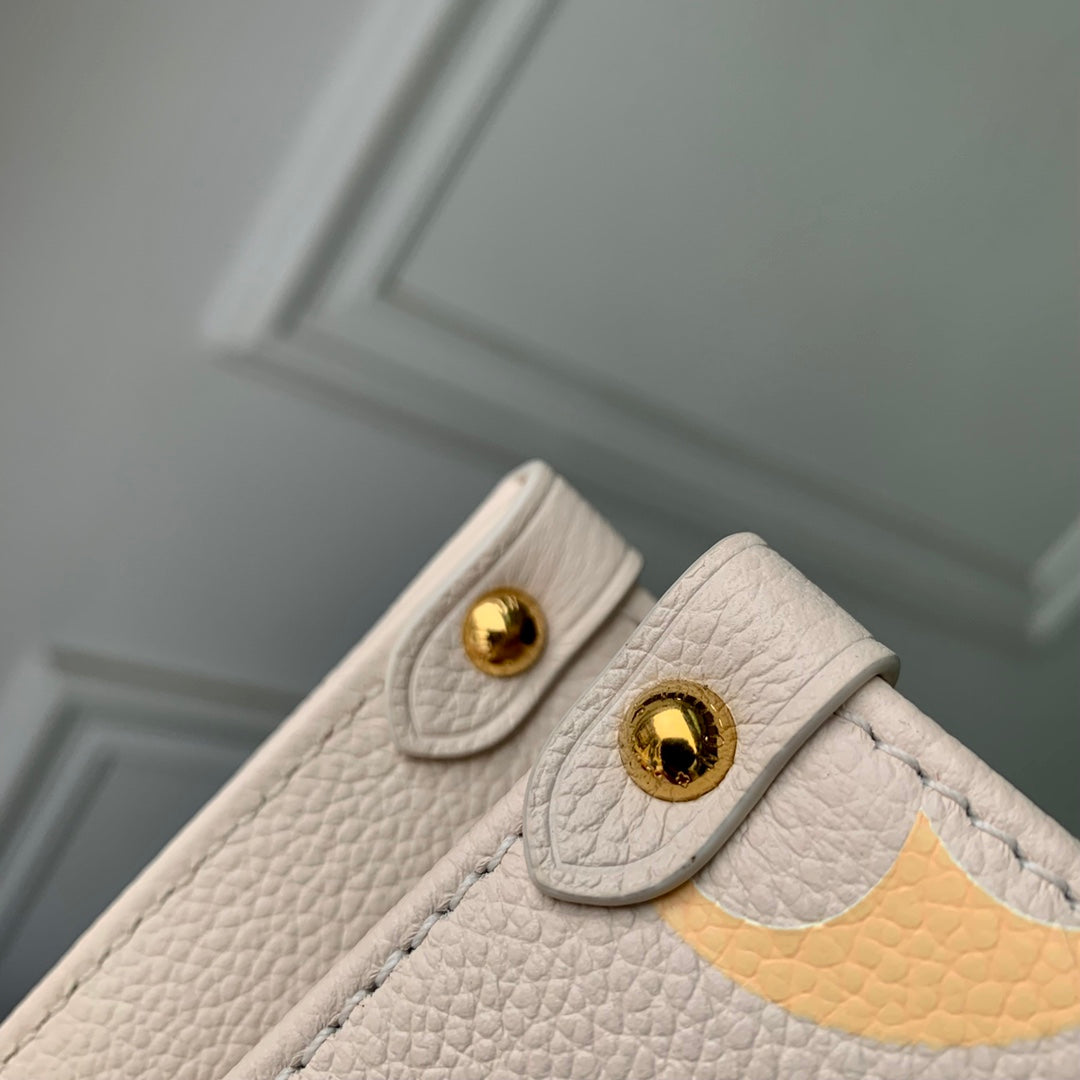 Louis Vuitton OnTheGo PM Monogram Empreinte Leather Tote Bag - Cream Gradient