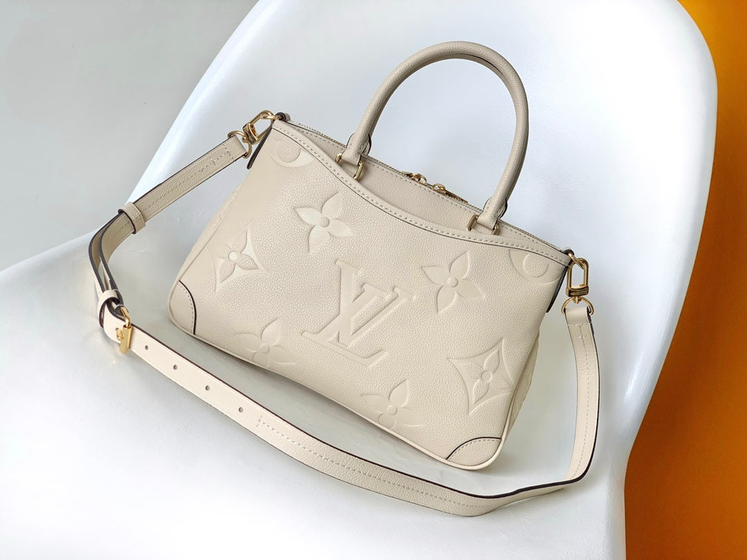 Louis Vuitton Monogram Empreinte Leather Handbag - Elegant Beige Top Handle Tote