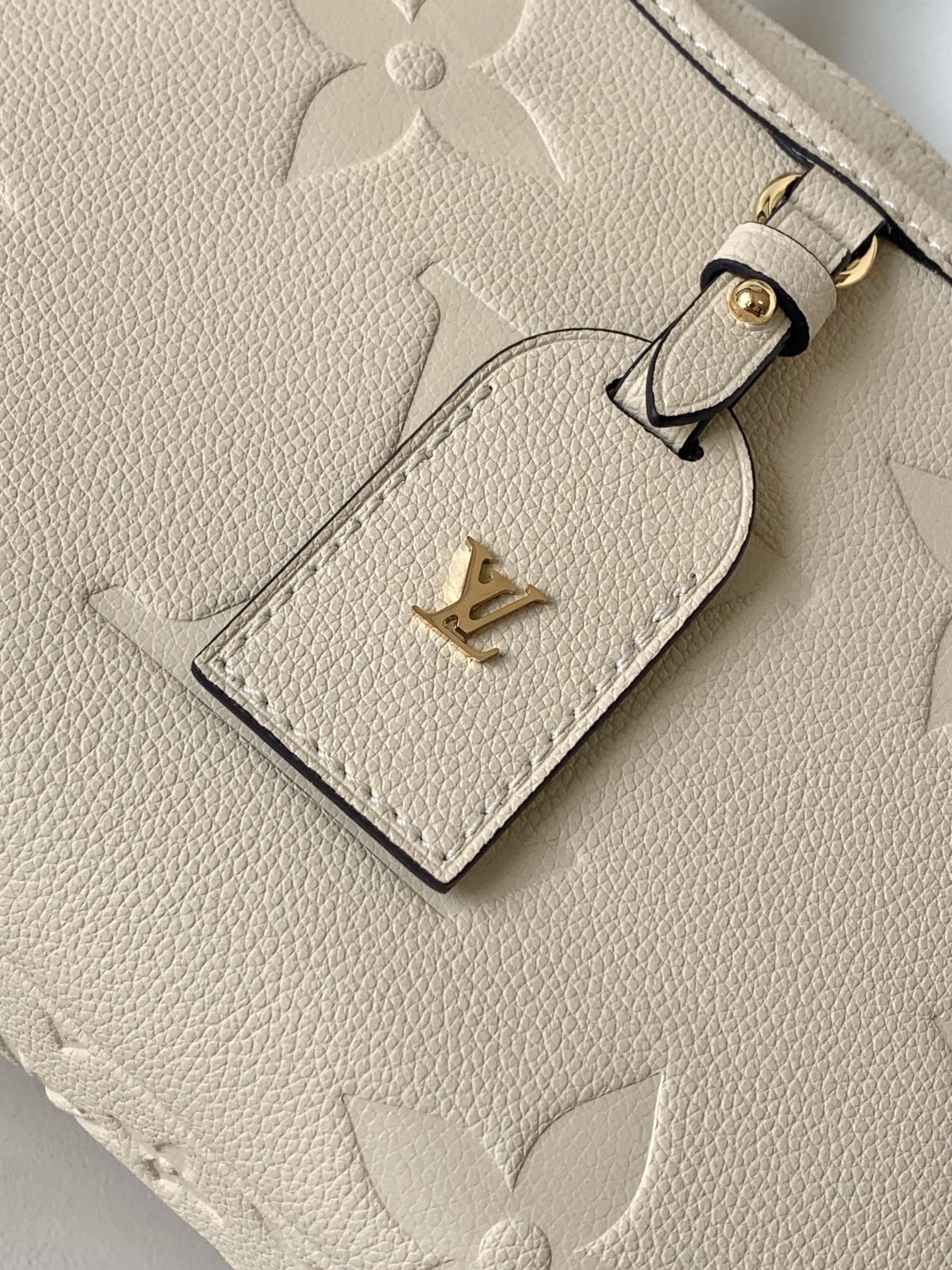 Louis Vuitton Monogram Empreinte Leather Handbag - Elegant Beige Top Handle Tote
