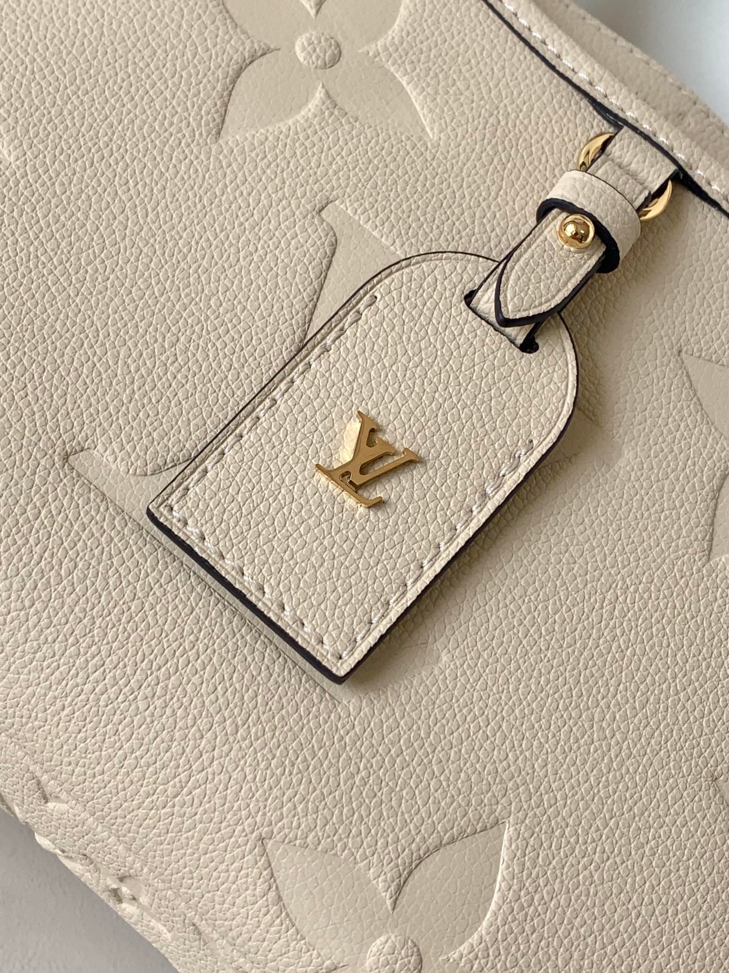 Louis Vuitton Monogram Empreinte Leather Handbag - Elegant Beige Top Handle Tote