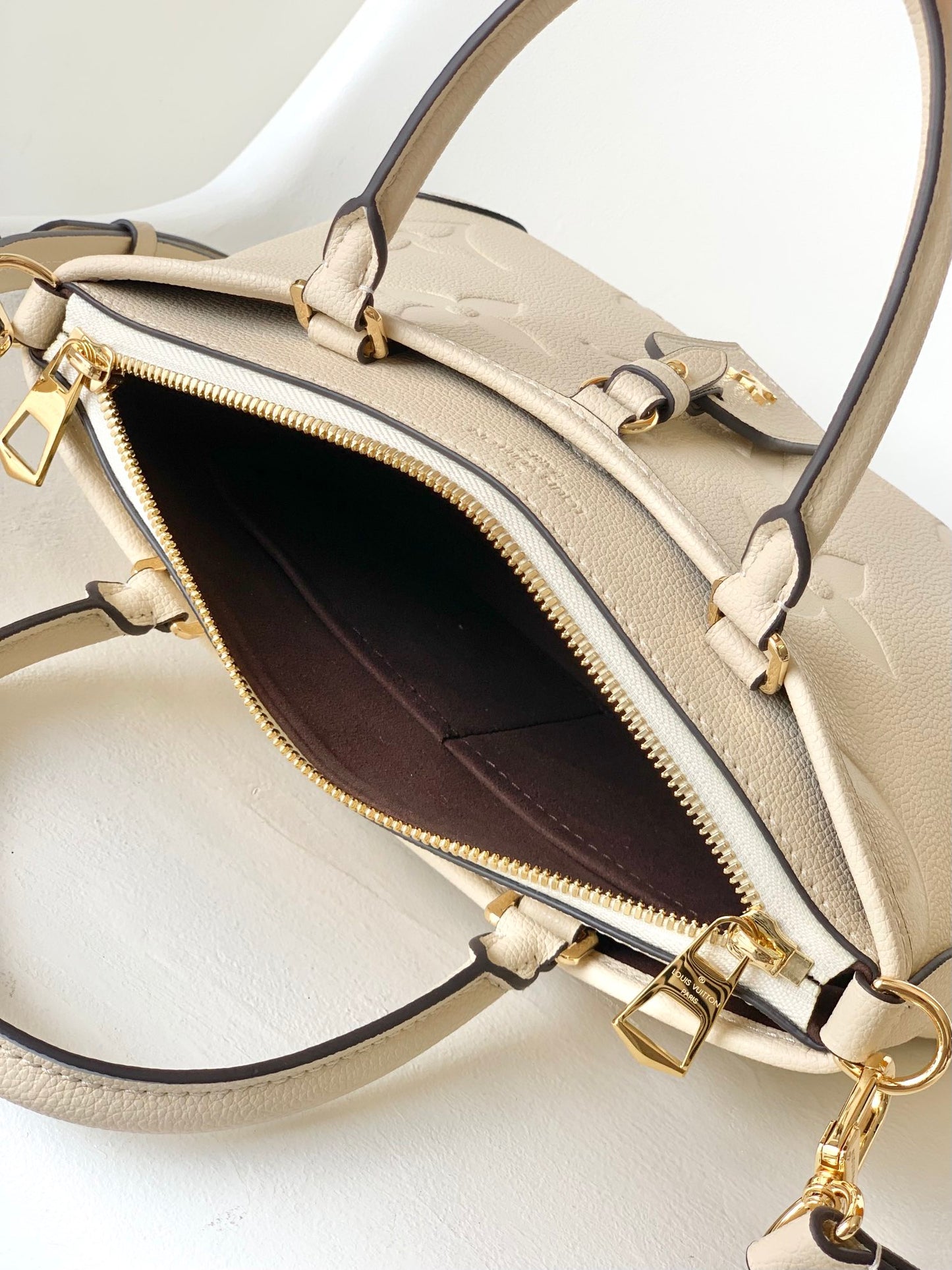 Louis Vuitton Monogram Empreinte Leather Handbag - Elegant Beige Top Handle Tote
