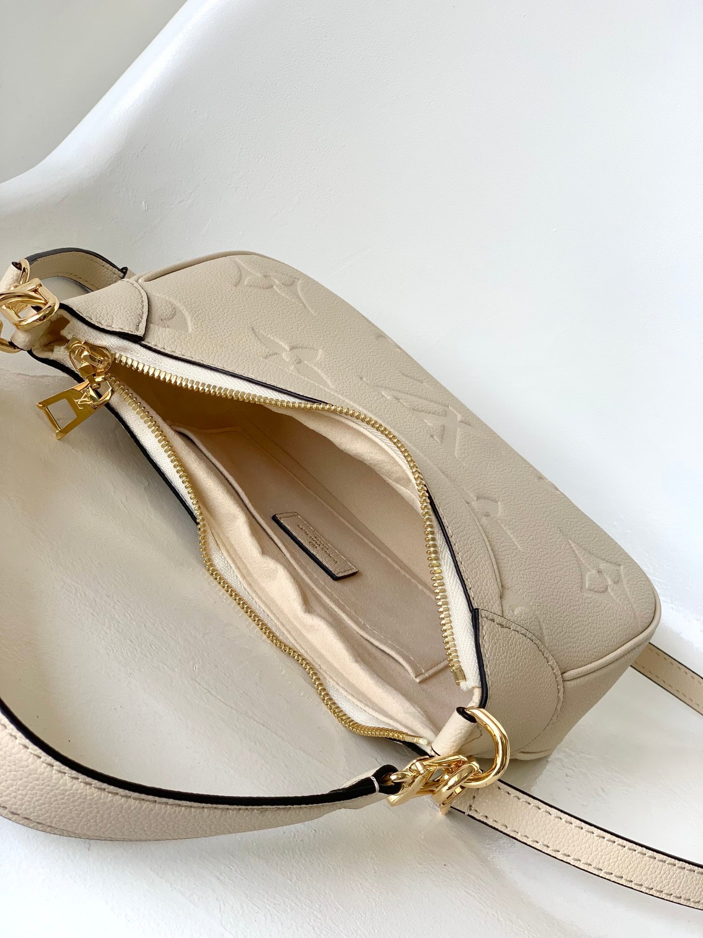 Louis Vuitton Bagatelle Hobo Bag in Monogram Empreinte Leather - Crème Beige