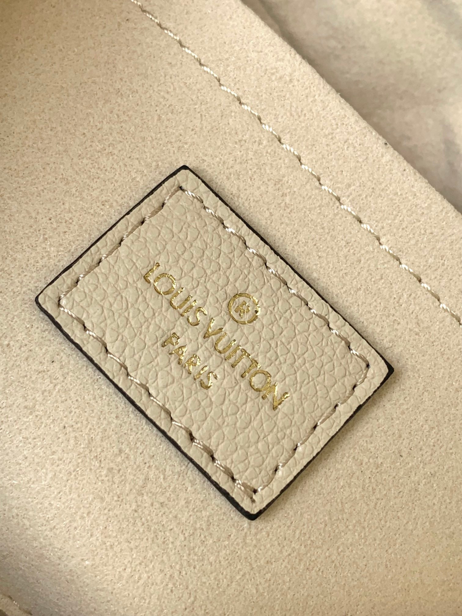 Louis Vuitton Bagatelle Hobo Bag in Monogram Empreinte Leather - Crème Beige