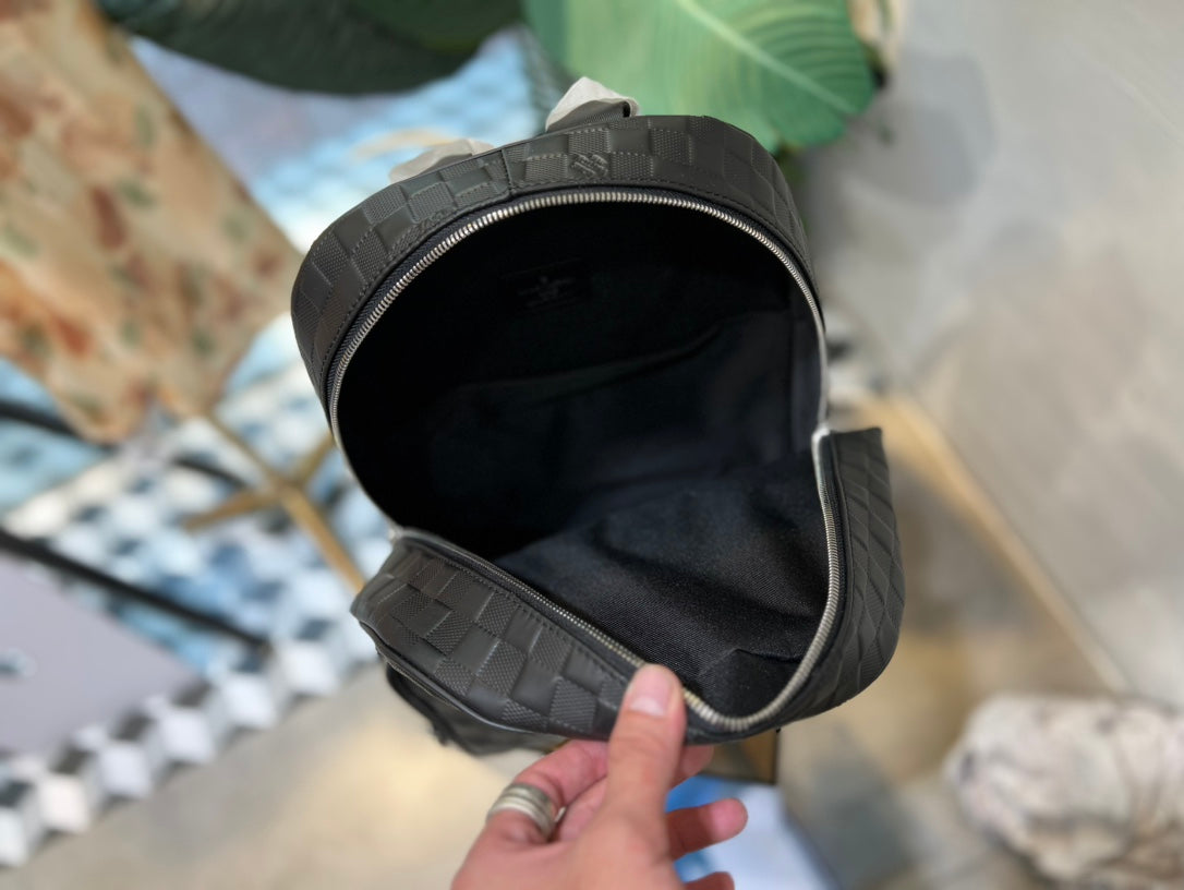 Louis Vuitton Black Woven Leather Texture Unisex Backpack with Zip Front Pocket