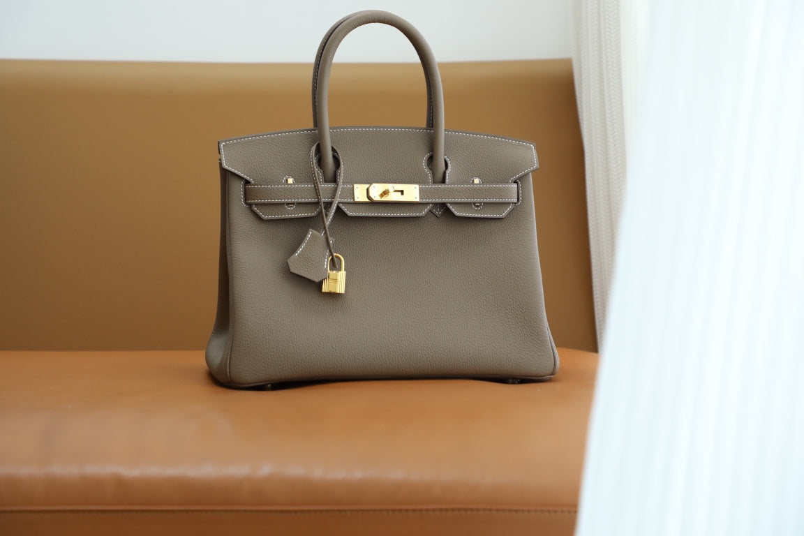 Elegant Taupe Leather Top-Handle Handbag with Gold-Tone Hardware