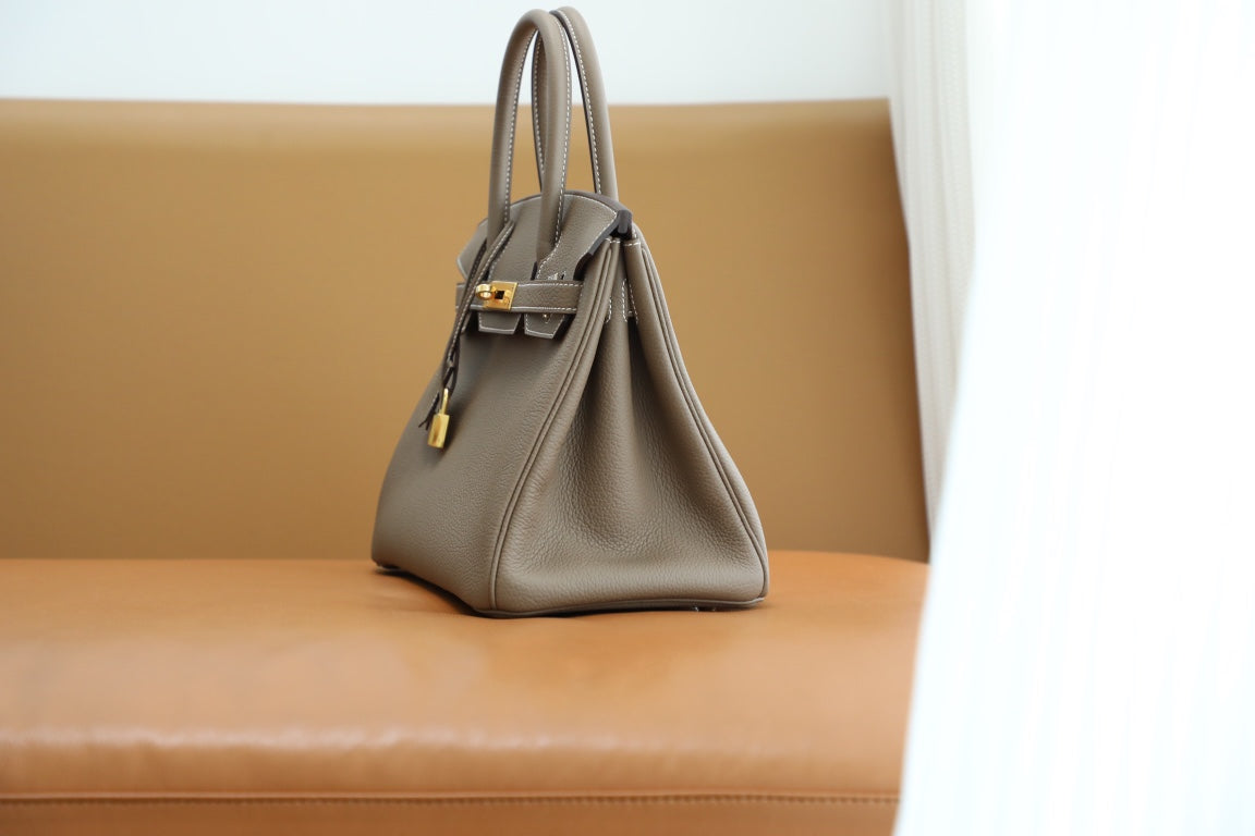 Elegant Taupe Leather Top-Handle Handbag with Gold-Tone Hardware