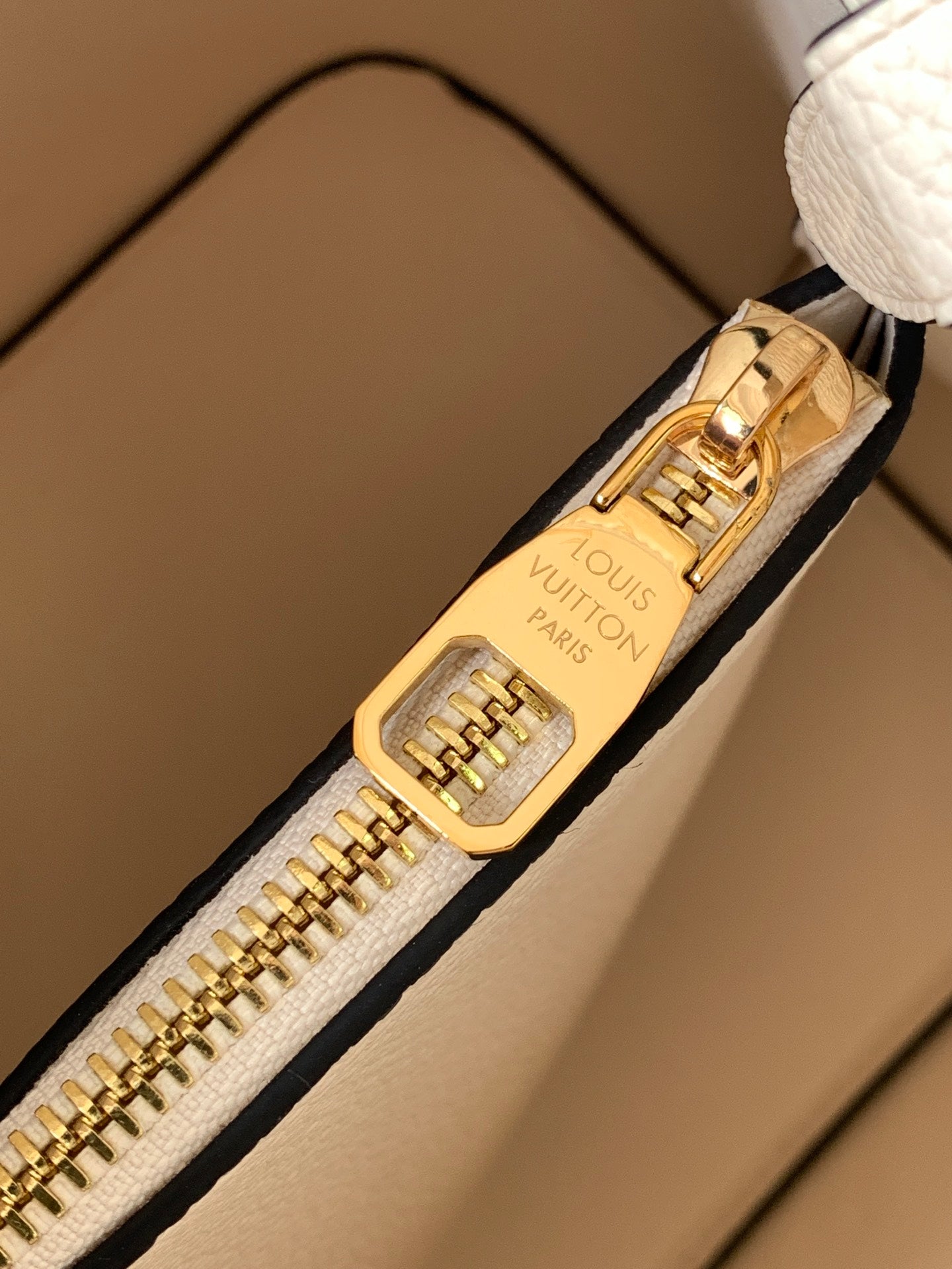 Louis Vuitton Elegant Cream Perforated Leather Drawstring Bucket Bag