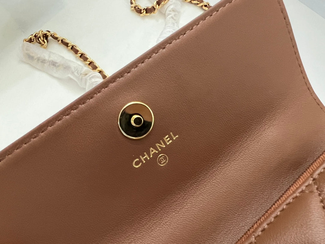 Brown Quilted Handbag with Jeweled Top Handle and Gold Chain Strap