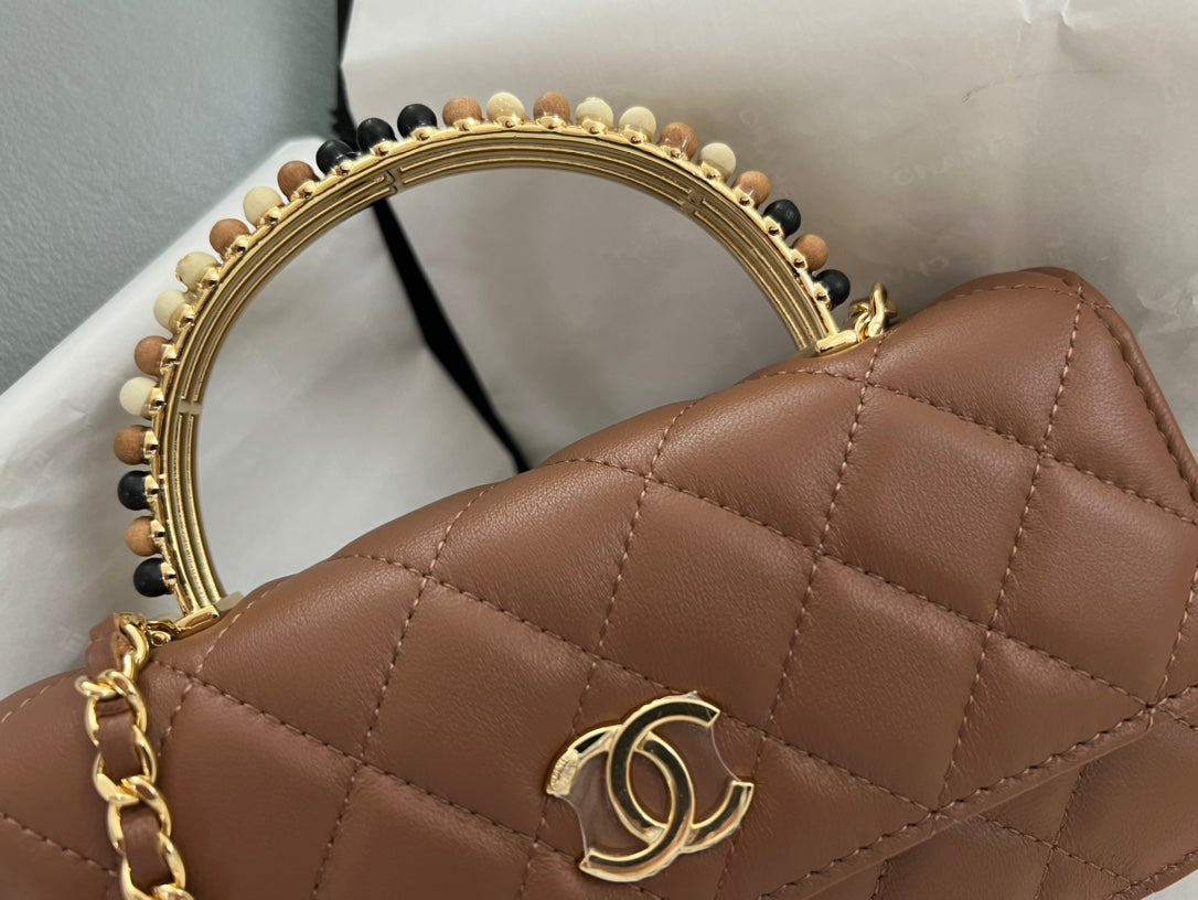 Brown Quilted Handbag with Jeweled Top Handle and Gold Chain Strap