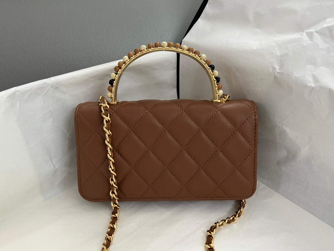 Brown Quilted Handbag with Jeweled Top Handle and Gold Chain Strap