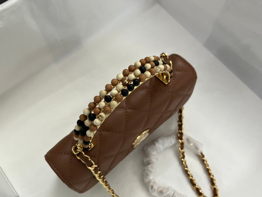 Brown Quilted Handbag with Jeweled Top Handle and Gold Chain Strap