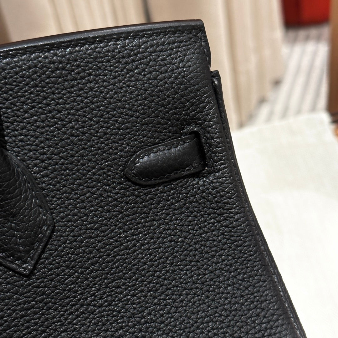 Luxury Black Leather Top-Handle Handbag with Horse Charm and Gold Hardware
