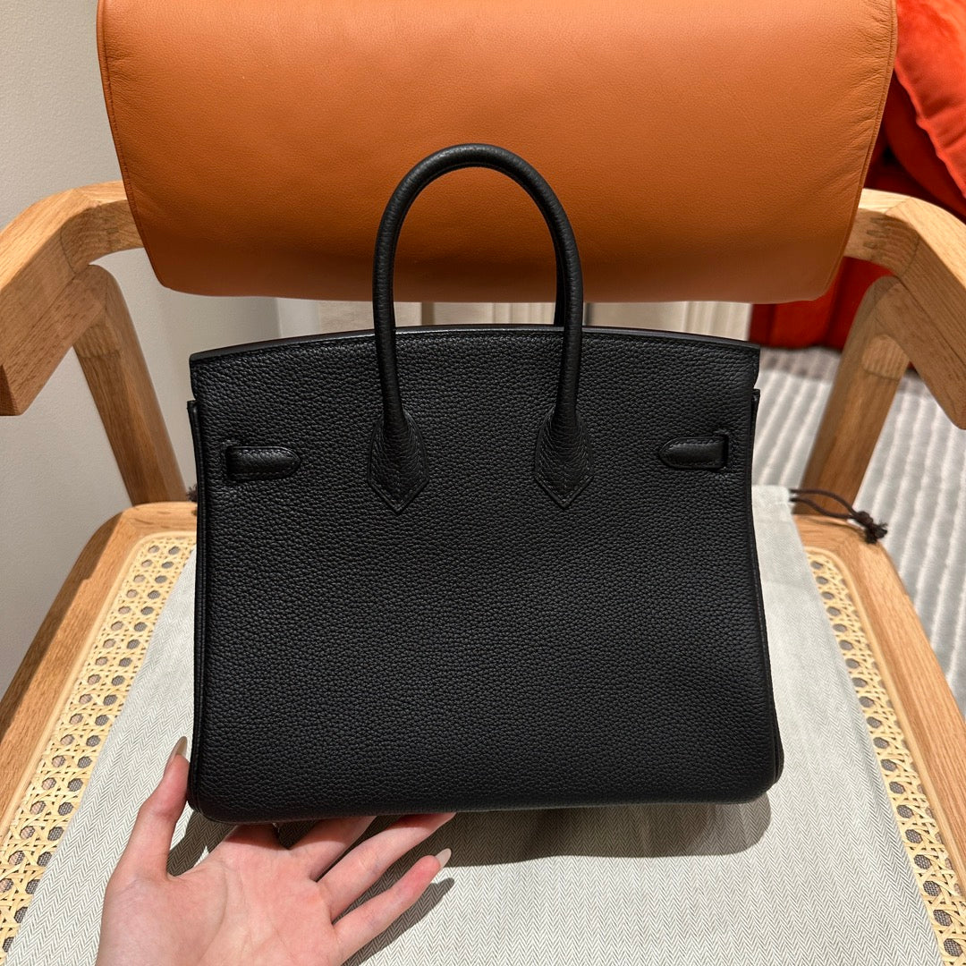Luxury Black Leather Top-Handle Handbag with Horse Charm and Gold Hardware