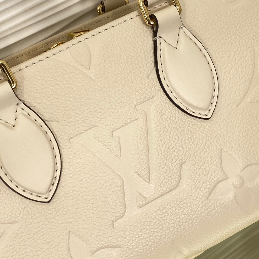Louis Vuitton Palais East West Monogram Empreinte Leather Handbag - Cream