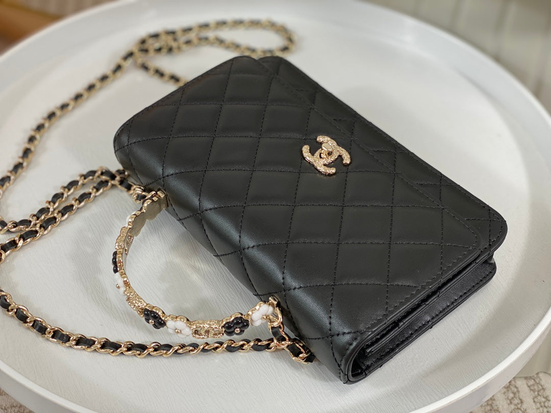 Chanel Black Quilted Leather Flap Bag with Top Handle and Gold Hardware