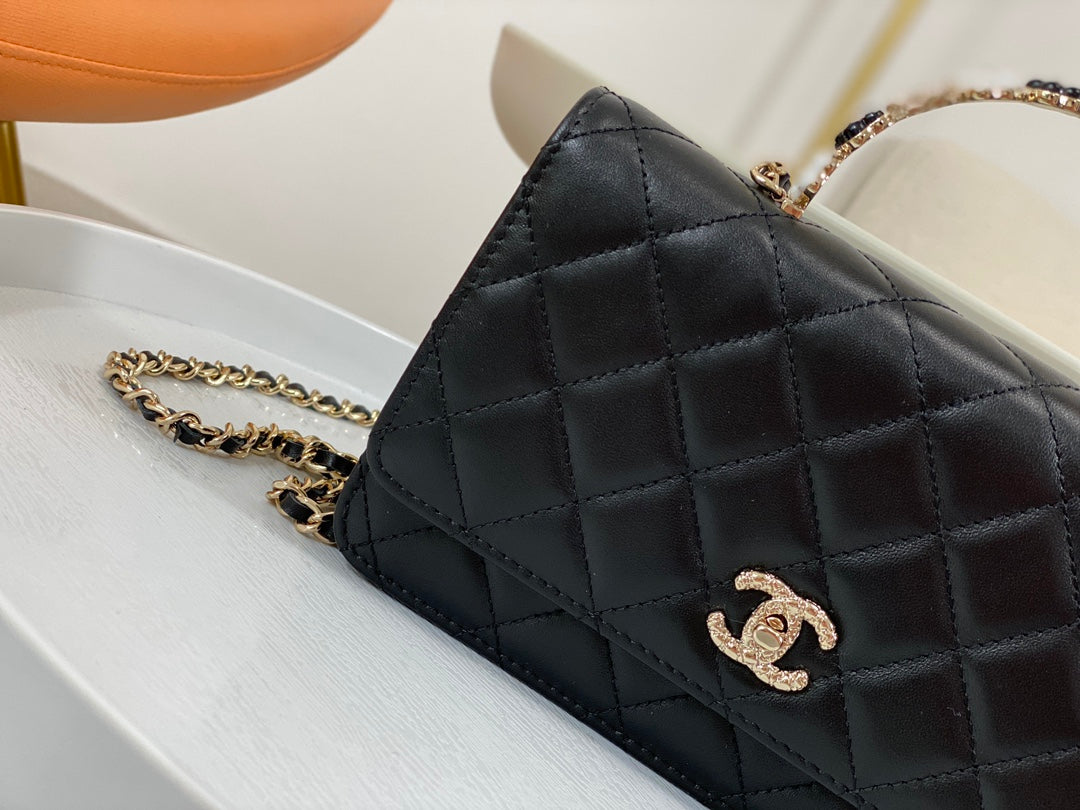 Chanel Black Quilted Leather Flap Bag with Top Handle and Gold Hardware