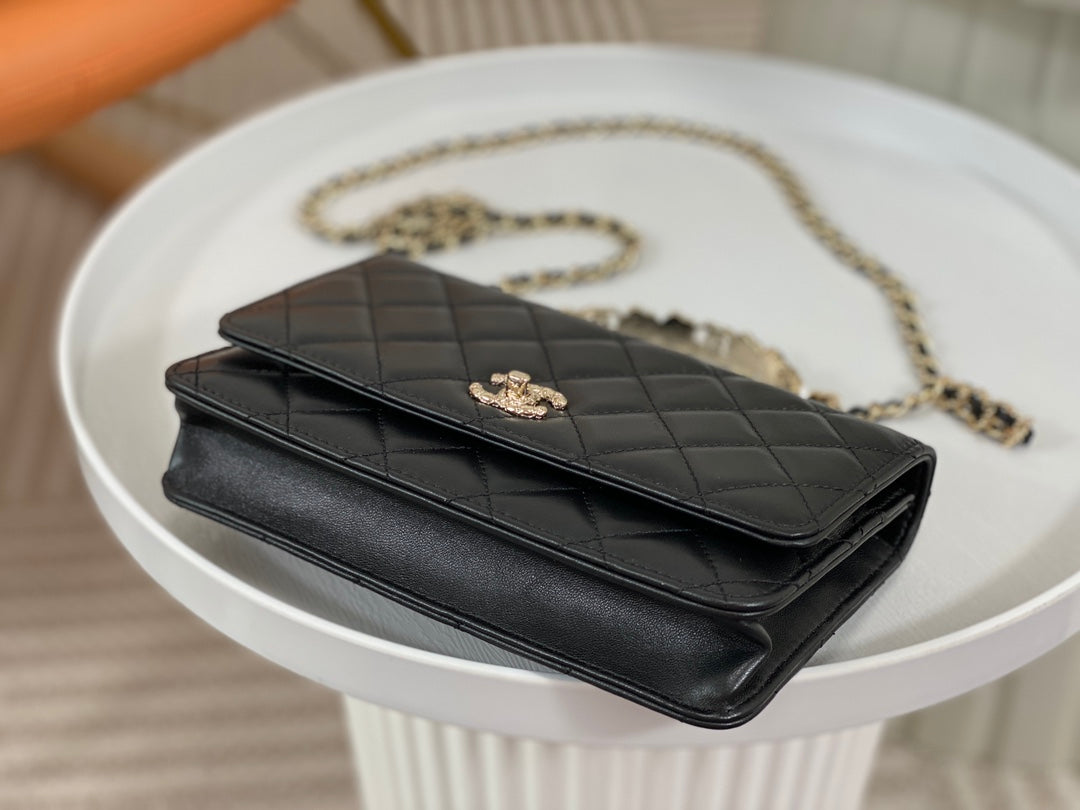 Chanel Black Quilted Leather Flap Bag with Top Handle and Gold Hardware