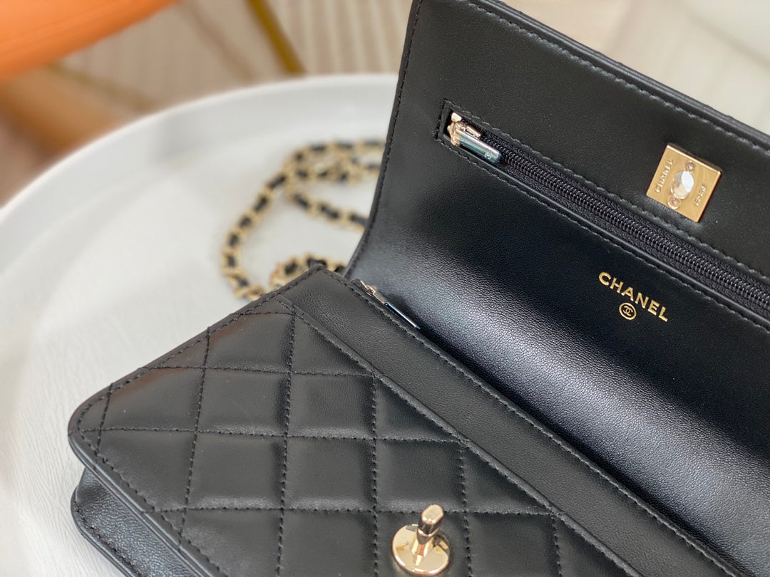 Chanel Black Quilted Leather Flap Bag with Top Handle and Gold Hardware