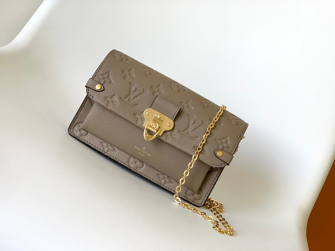 Louis Vuitton Elegant Taupe Embossed Leather Flap Handbag with Gold Chain Strap