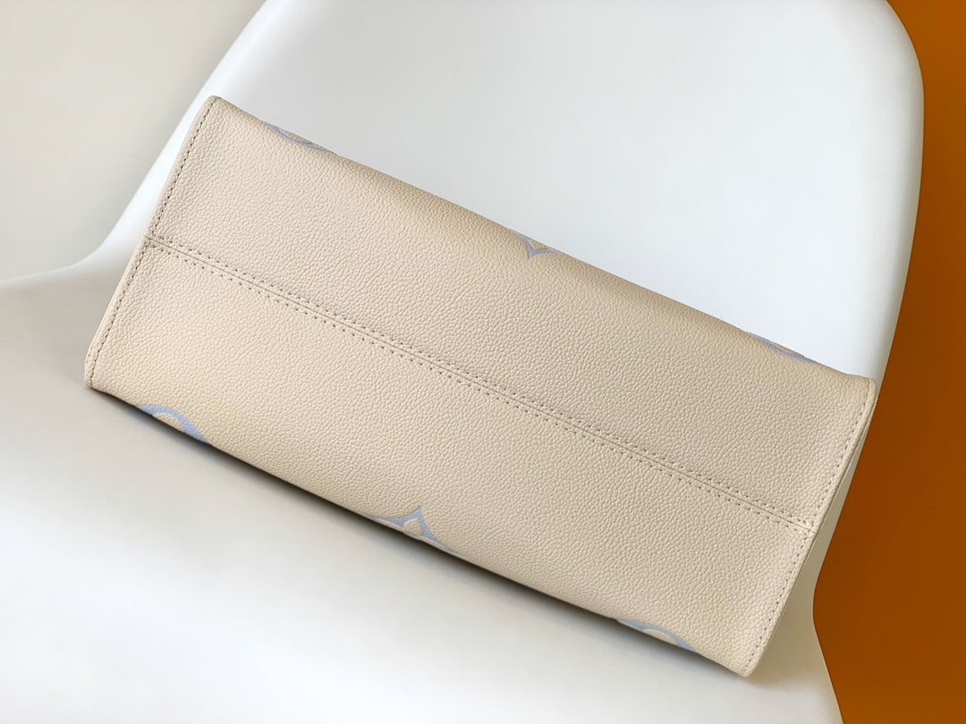 Louis Vuitton OnTheGo MM Monogram Empreinte Leather Tote Bag - Cream/Blue