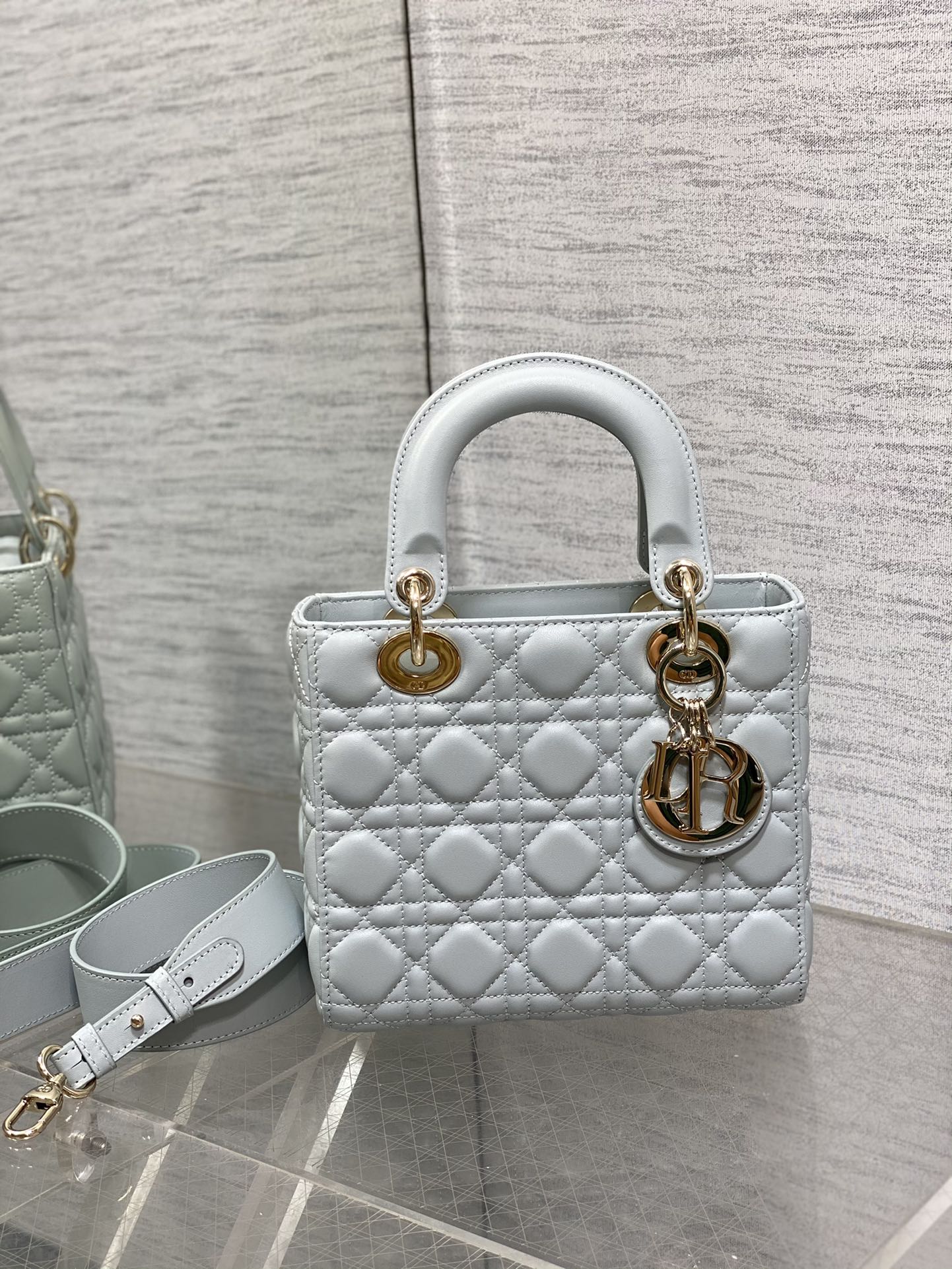 Dior Elegant Light Blue Quilted Leather Handbag with Crossbody Strap