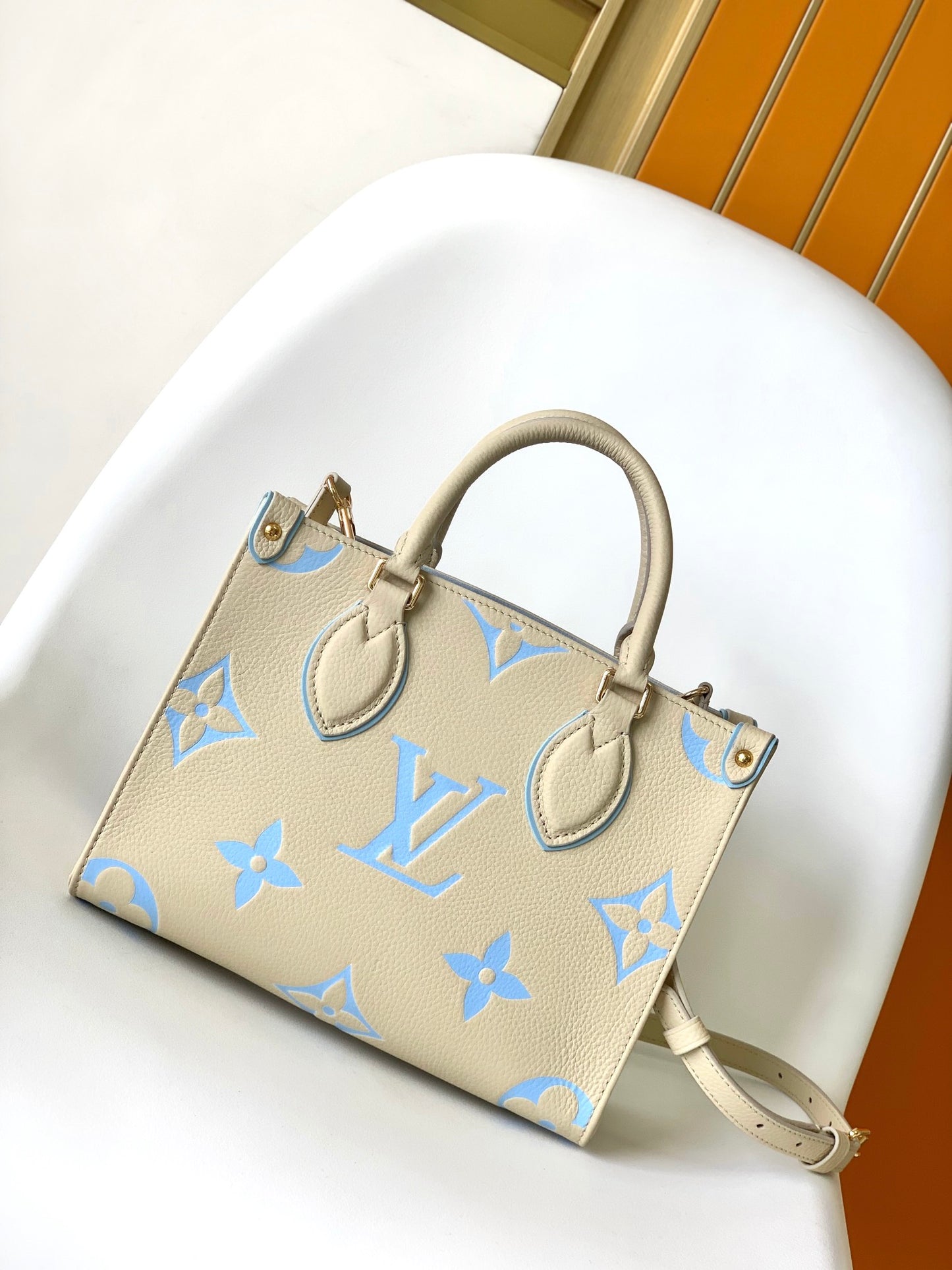 Louis Vuitton Chic Cream and Pastel Blue Monogram Embossed Leather Tote Handbag