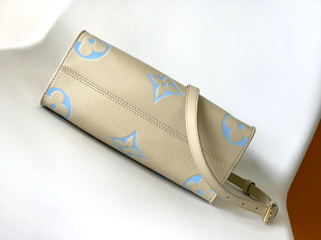 Louis Vuitton OnTheGo PM Monogram Empreinte Bicolor Leather Handbag - Cream/Blue