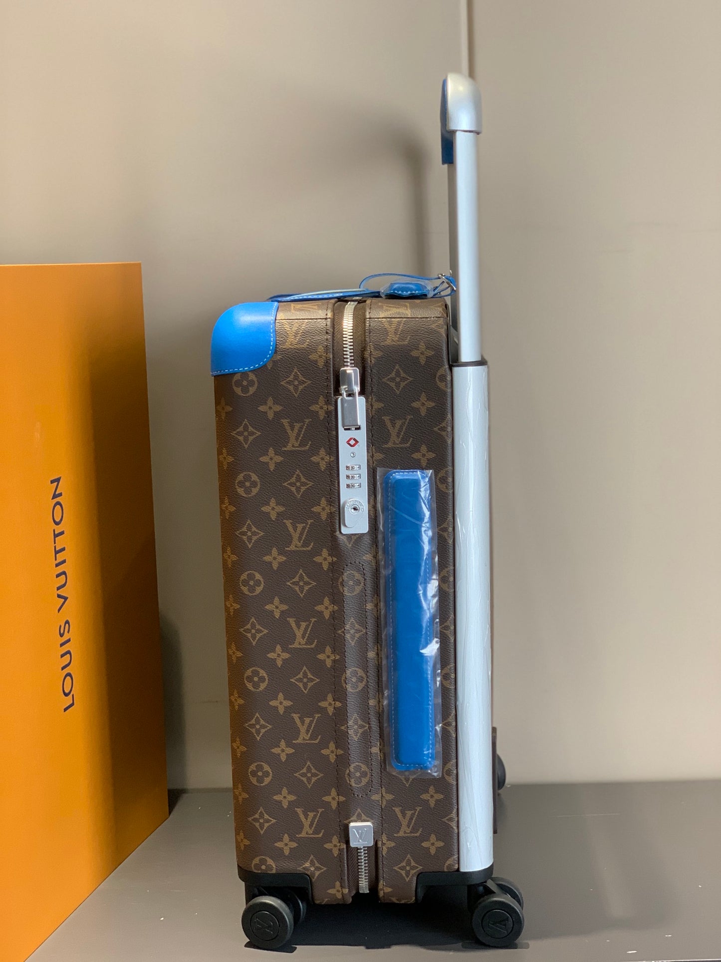 Retro Brown Monogram Spinner Suitcase with Blue Leather Trim