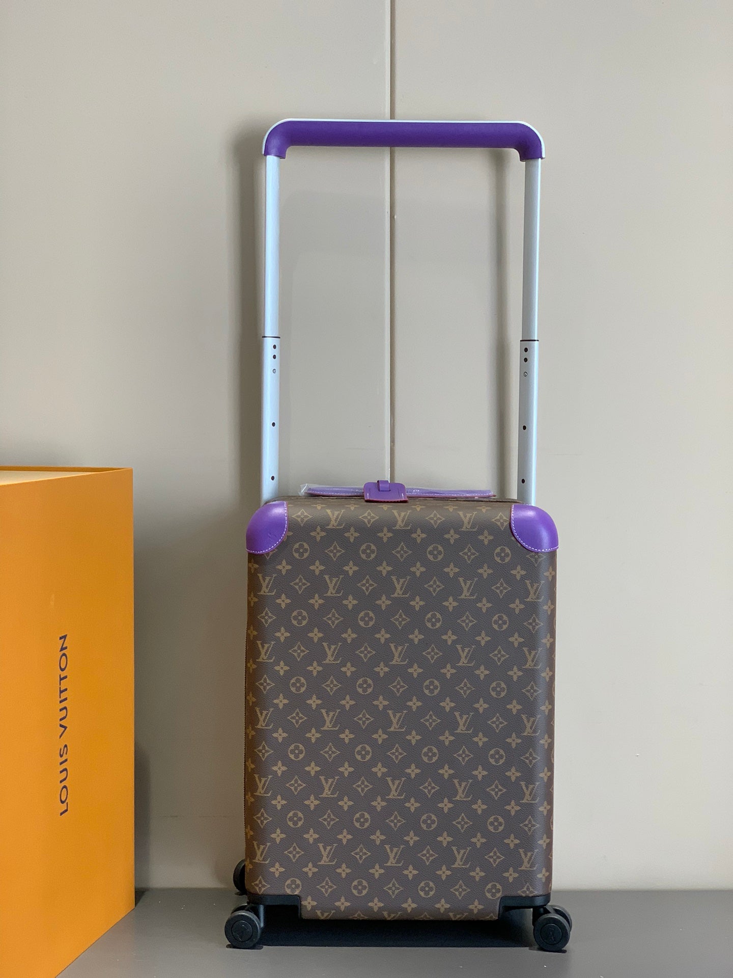 Luxury Brown Monogram Rolling Suitcase with Purple Accents