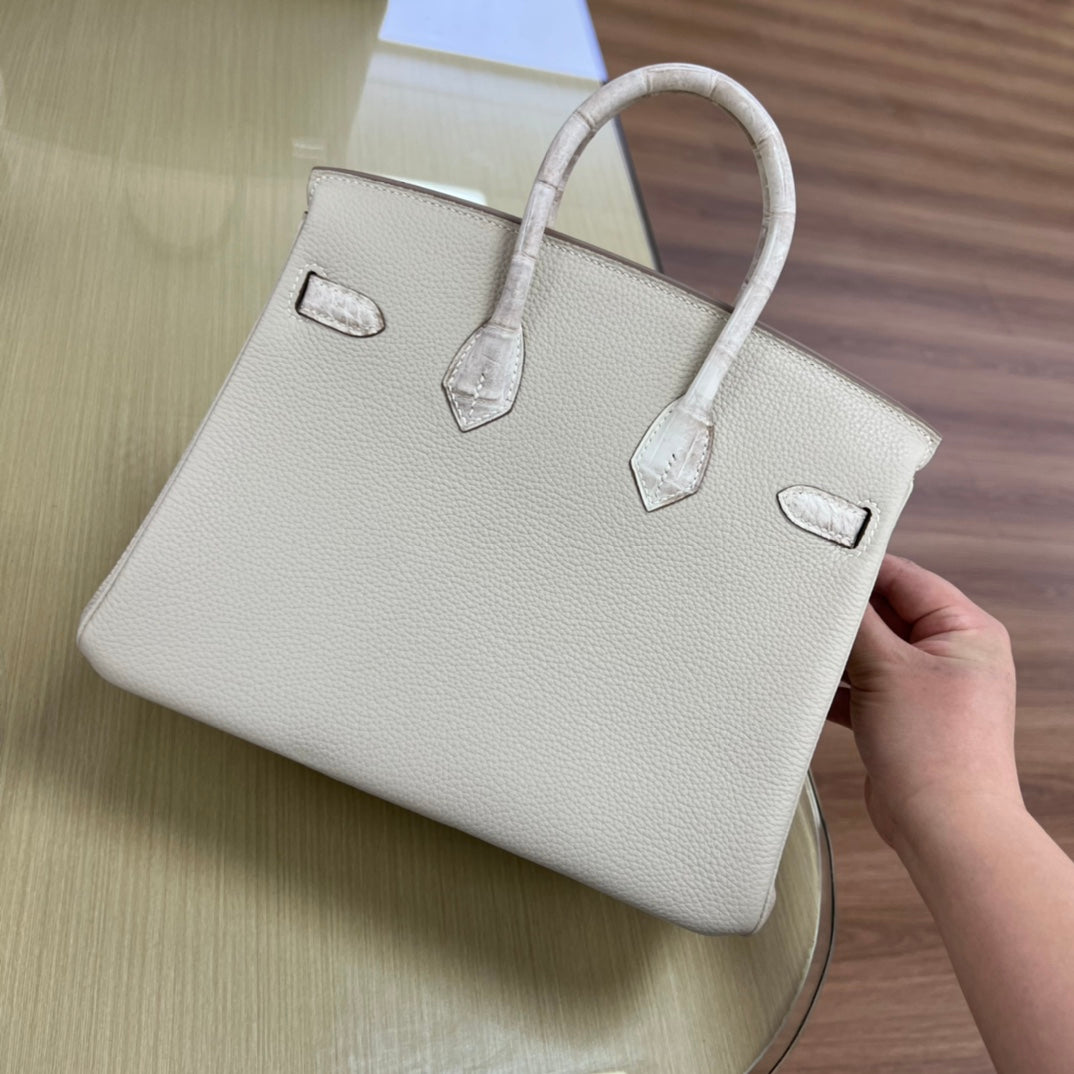 Elegant Cream Leather Top Handle Handbag with Textured Accents