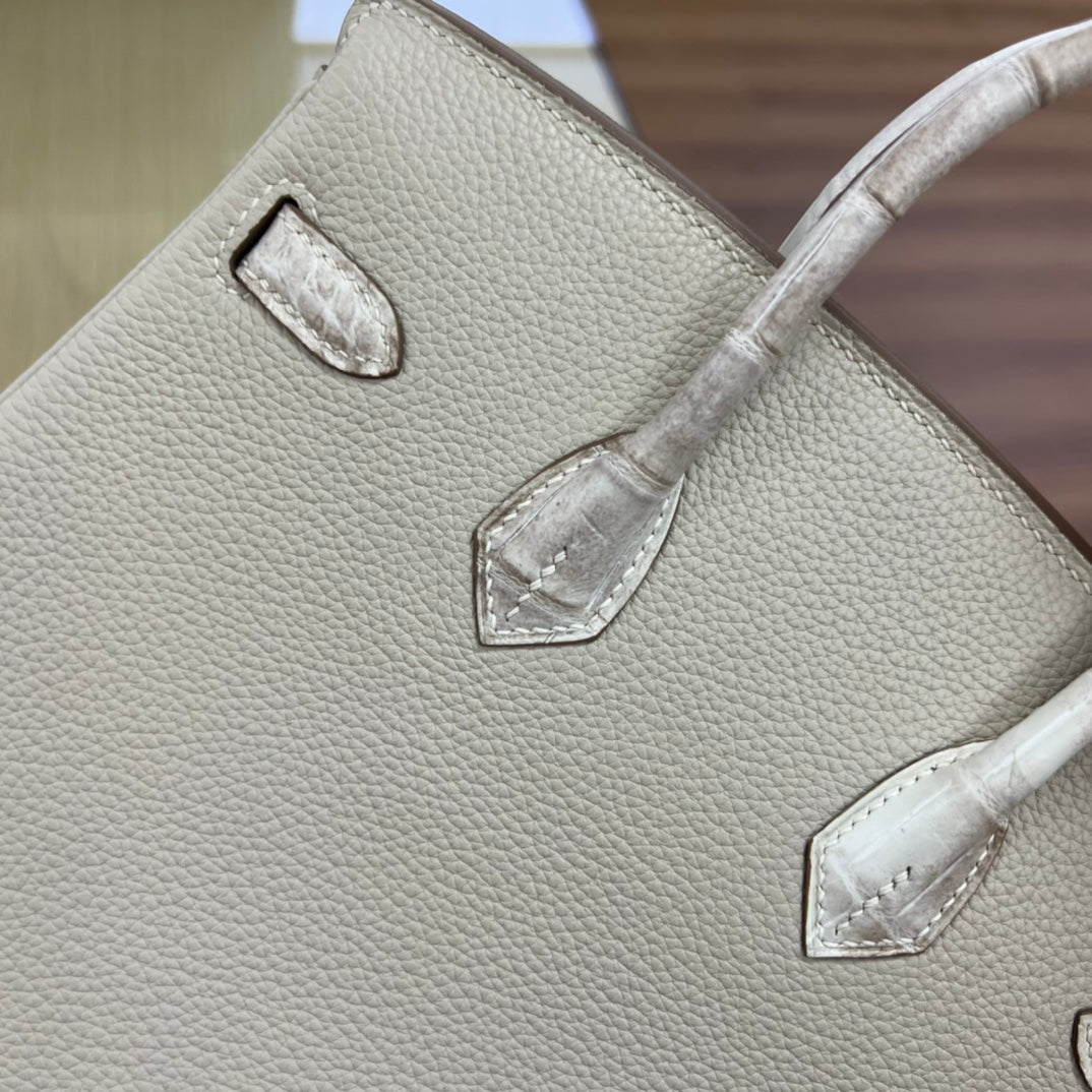 Elegant Cream Leather Top Handle Handbag with Textured Accents