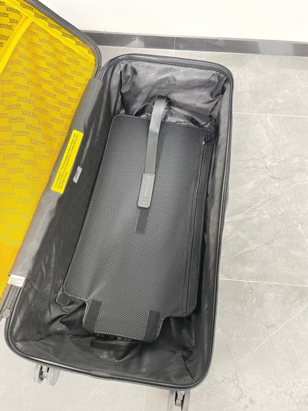Black Spinner Carry-On Luggage with Yellow Accent Strap