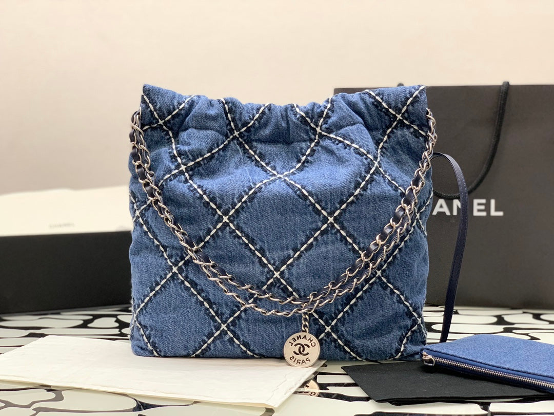 Chanel Quilted Denim Drawstring Bag with Silver-Tone Chain