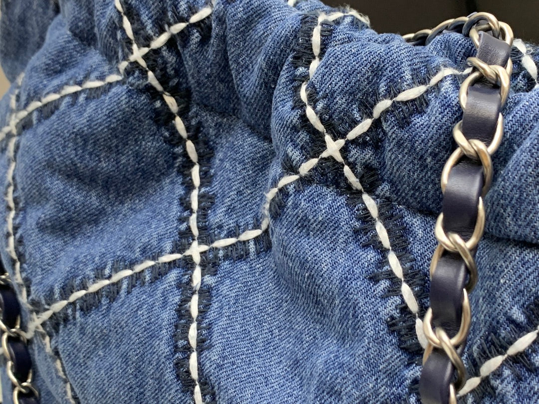 Chanel Quilted Denim Drawstring Bag with Silver-Tone Chain
