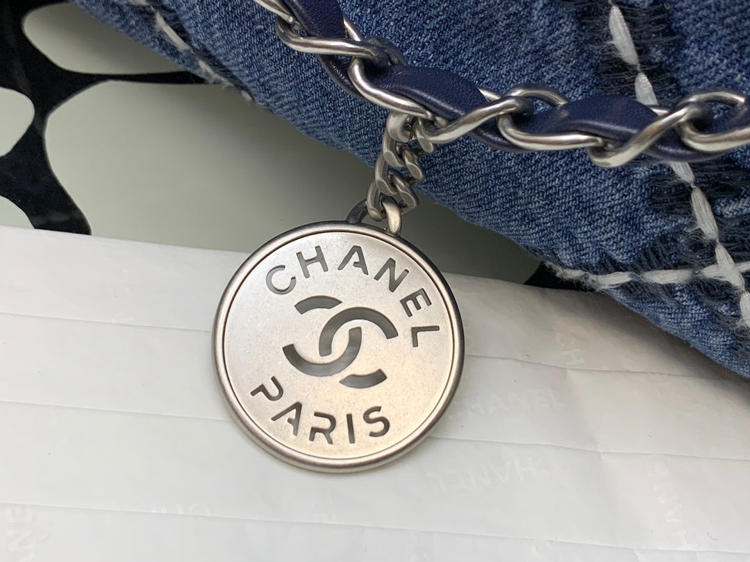 Chanel Quilted Denim Drawstring Bag with Silver-Tone Chain
