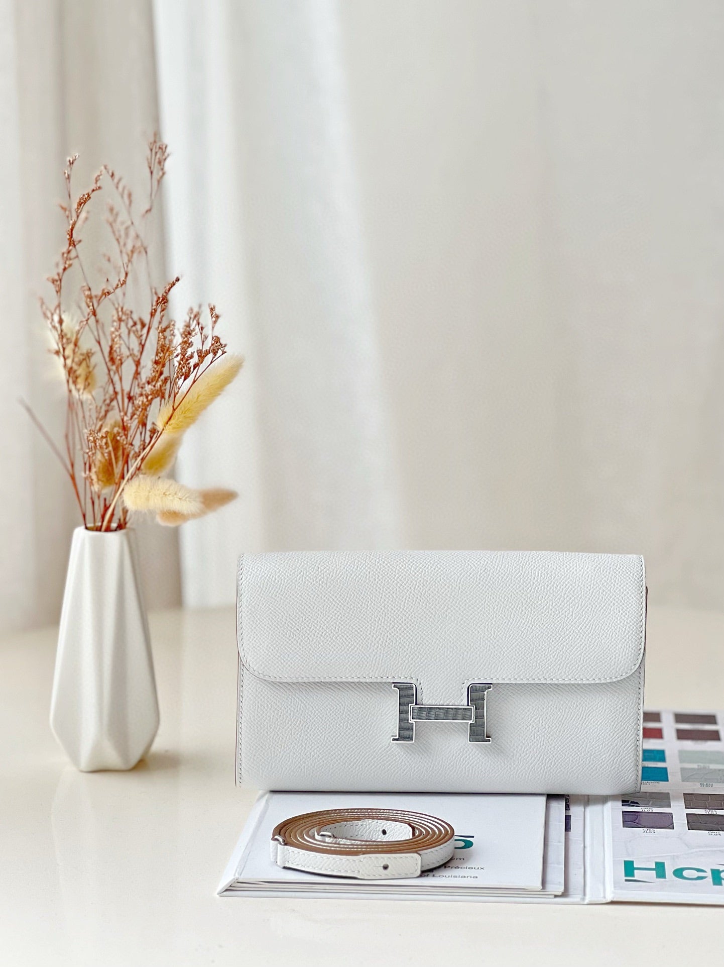 Elegant Cream Leather Crossbody Bag with Gold H-Logo Clasp